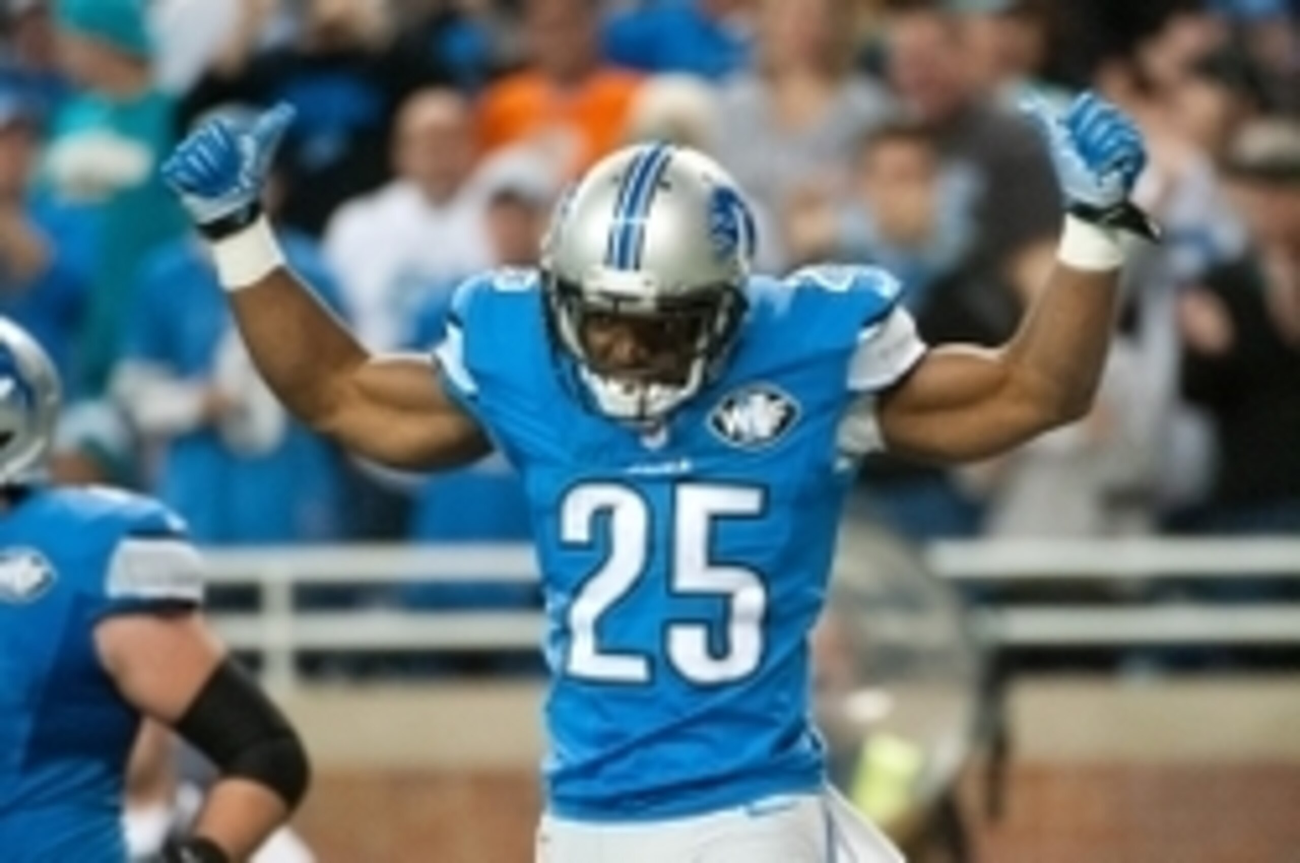 Nov 9, 2014; Detroit, MI, USA; Detroit Lions running back Theo Riddick (25) celebrates his touchdown during the fourth quarter against the Miami Dolphins at Ford Field. Detroit won 20-16. Mandatory Credit: Tim Fuller-USA TODAY Sports