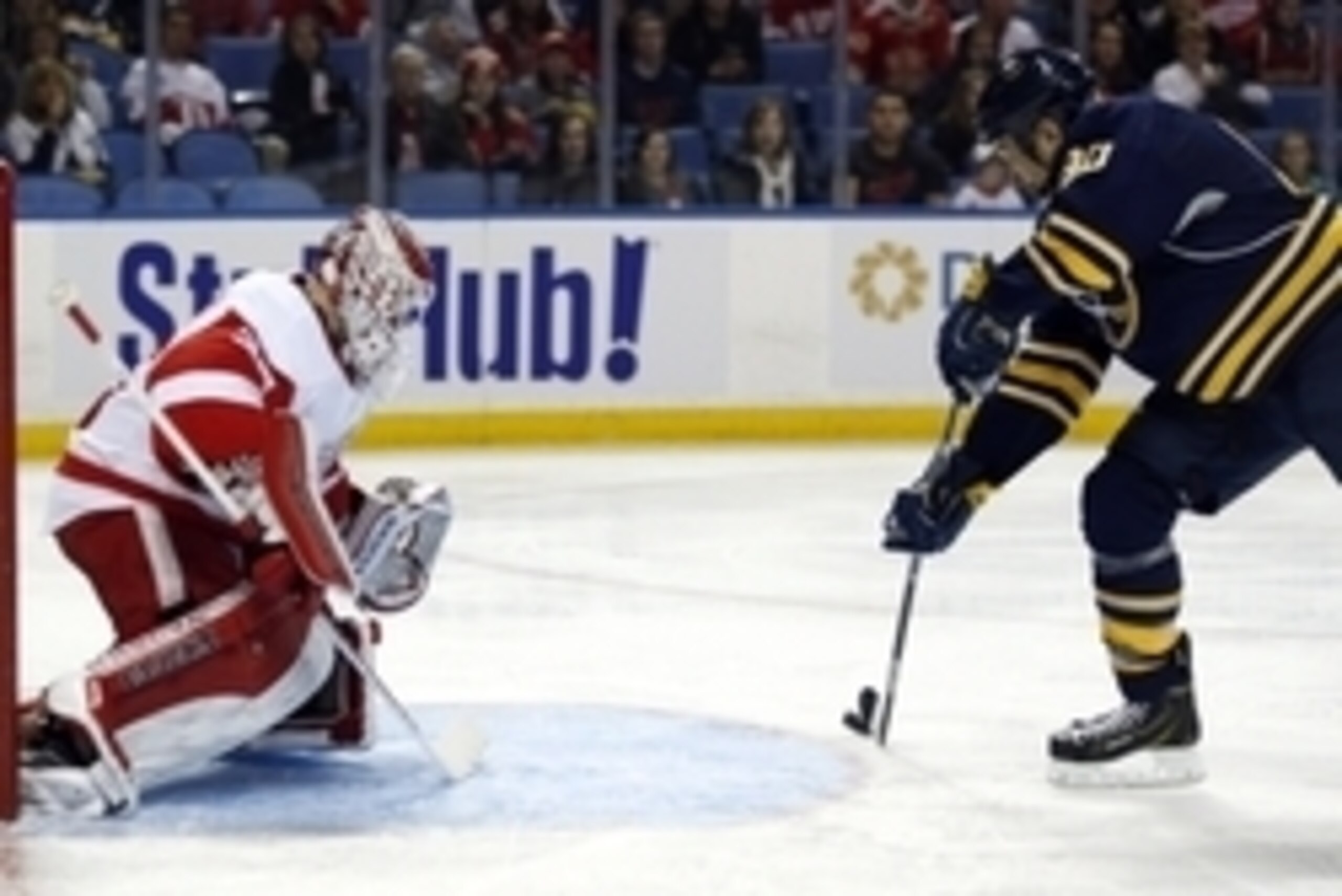 Nov 2, 2014; Buffalo, NY, USA; Buffalo Sabres right wing Chris Stewart (80) shoots the puck on a breakaway against Detroit Red Wings goalie Jimmy Howard (35) during the second period at First Niagara Center. Mandatory Credit: Kevin Hoffman-USA TODAY Sport