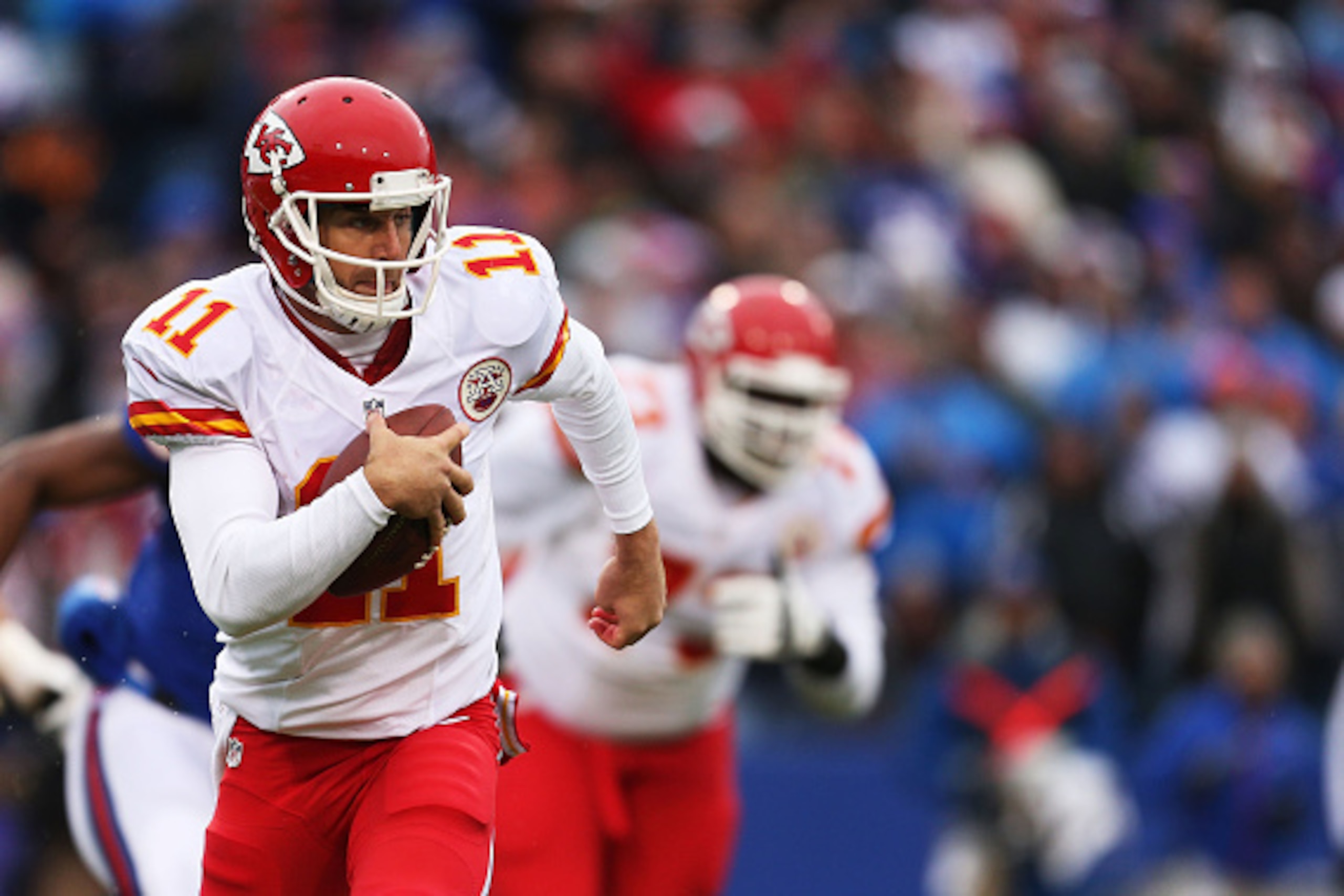 ORCHARD PARK, NY - NOVEMBER 09:   Alex Smith #11 of the Kansas City Chiefs runs from the pocket against the Buffalo Bills during the first half at Ralph Wilson Stadium on November 9, 2014 in Orchard Park, New York.  (Photo by Brett Carlsen/Getty Images)
