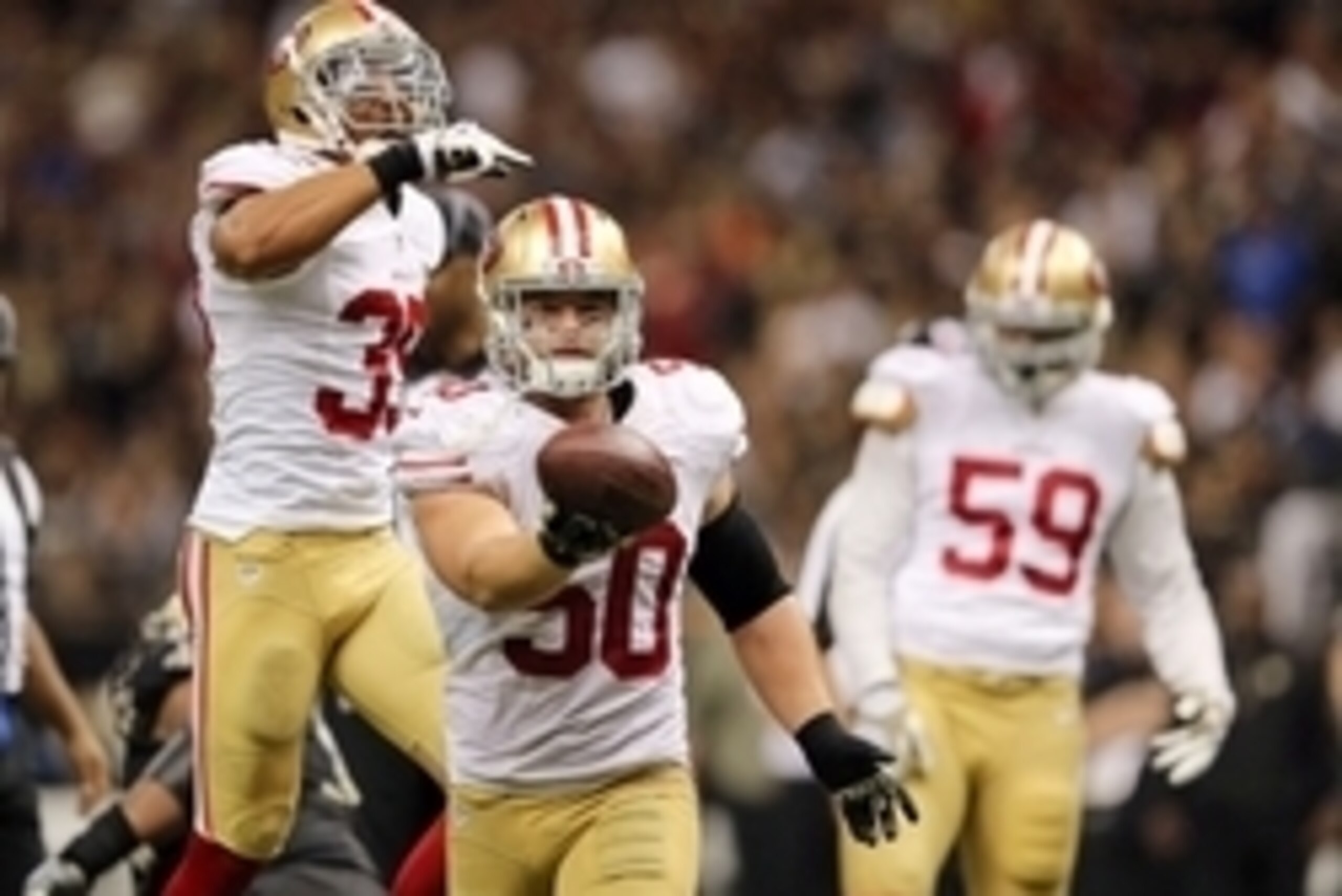Nov 9, 2014; New Orleans, LA, USA; San Francisco 49ers inside linebacker Chris Borland (50) celebrates after a fumble by New Orleans Saints quarterback Drew Brees (not pictured) in overtime at Mercedes-Benz Superdome. The 49ers won 27-24. Mandatory Credit