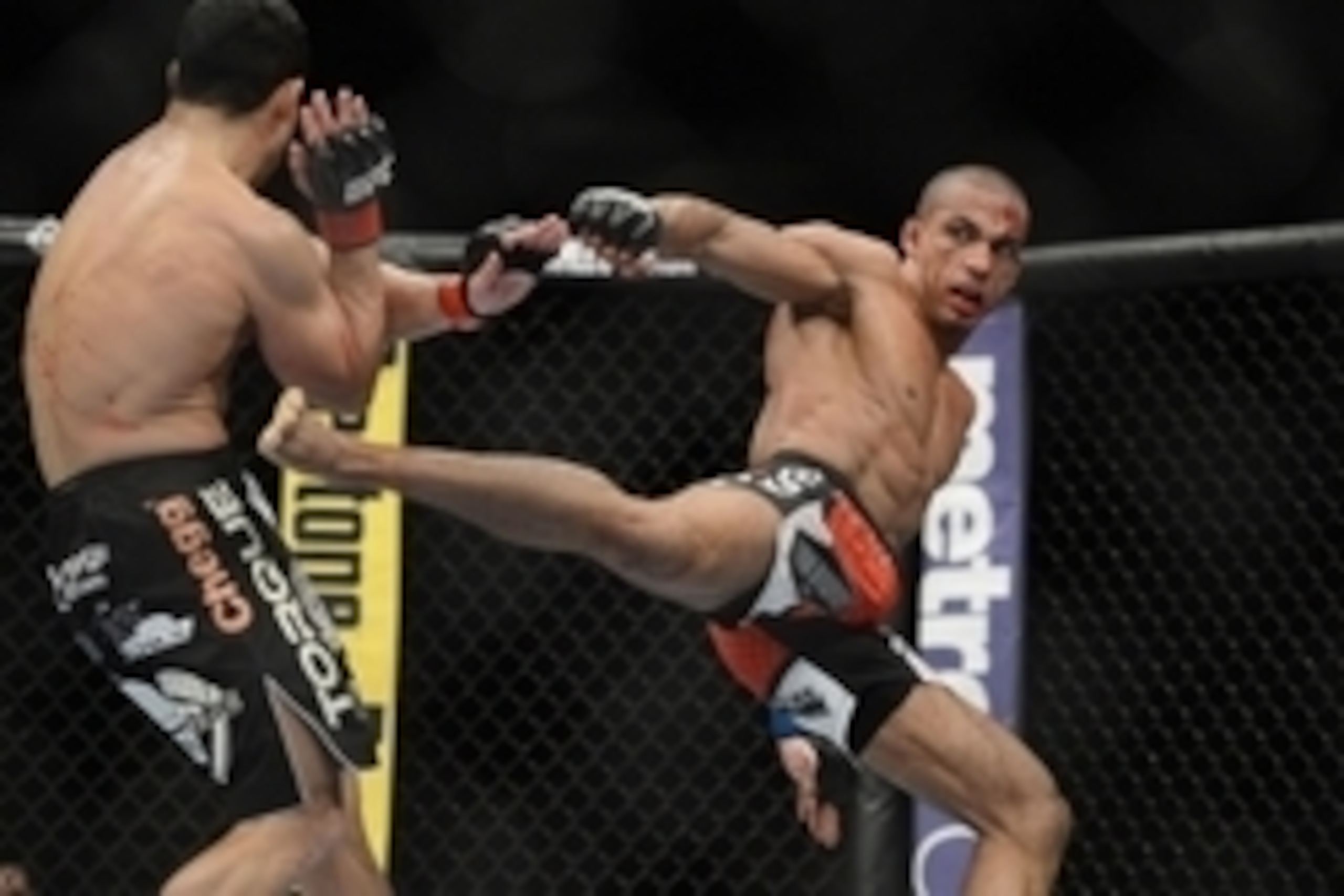 December 14, 2013; Sacramento, CA, USA; Danny Castillo (red gloves) fights Edson Barboza (blue gloves) during the lightweight bout of the UFC on FOX 9 at Sleep Train Arena. Mandatory Credit: Kyle Terada-USA TODAY Sports