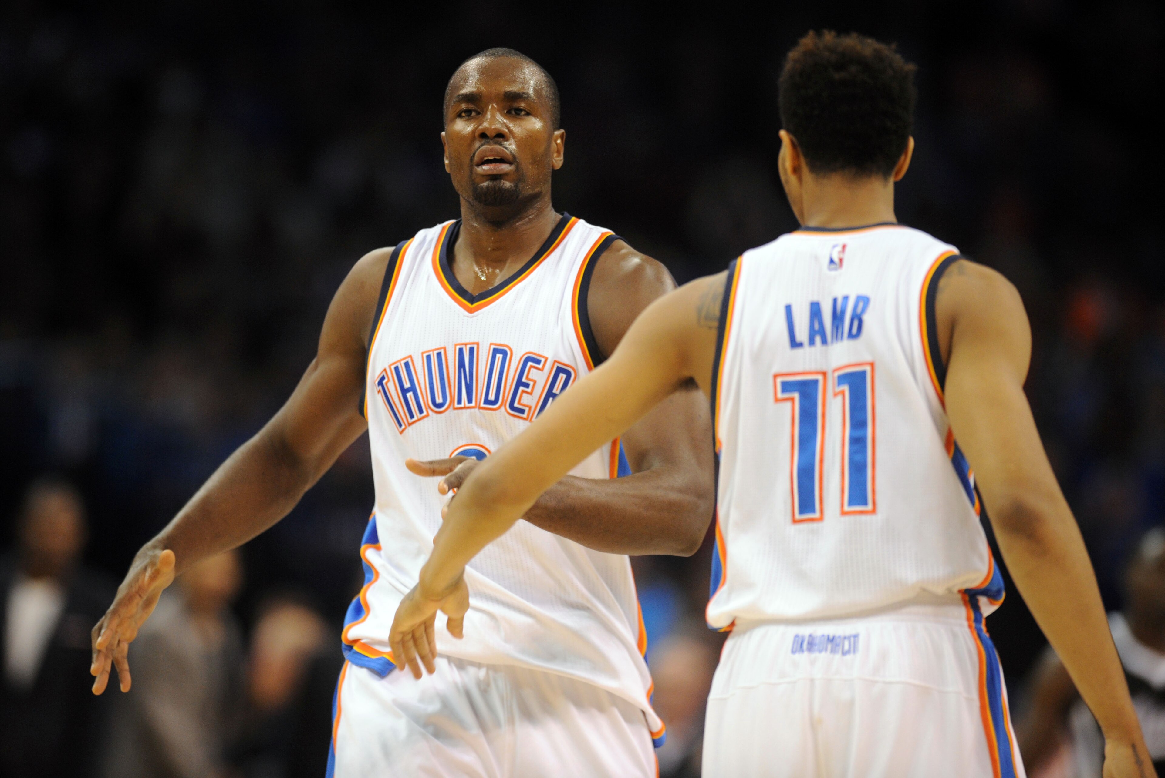Nov 9, 2014; Oklahoma City, OK, USA; Oklahoma City Thunder forward Serge Ibaka (9) is congratulated by Oklahoma City Thunder guard Jeremy Lamb (11) after a dunk against the Sacramento Kings during the second quarter at Chesapeake Energy Arena. Mandatory C