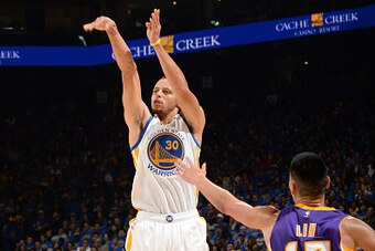 OAKLAND, CA - NOVEMBER 1: Stephen Curry #30 of the Golden State Warriors takes a shot against the Los Angeles Lakers on November 1, 2014 at Oracle Arena in Oakland, California. NOTE TO USER: User expressly acknowledges and agrees that, by downloading and/