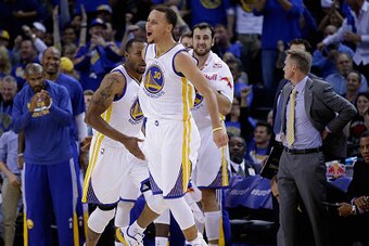 OAKLAND, CA - NOVEMBER 01:  Andre Iguodala #9 and Stephen Curry #30 of the Golden State Warriors react after Iguodala made a dunk against the Los Angeles Lakers at ORACLE Arena on November 1, 2014 in Oakland, California. NOTE TO USER: User expressly ackno