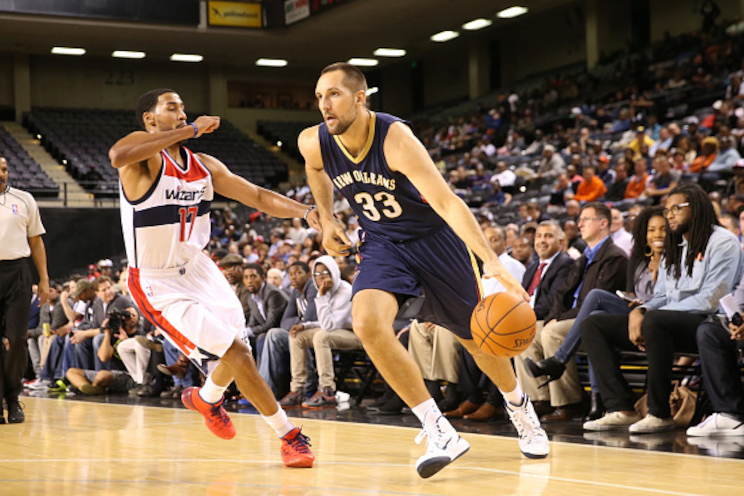 BALTIMORE, MD - OCTOBER 20: Ryan Anderson #33 of the New Orleans Pelicans drives against Garrett Temple #17 of the Washington Wizards during a preseason game at the Royal Farms Arena on October 20, 2014 in Baltimore, Maryland. NOTE TO USER: User expressly