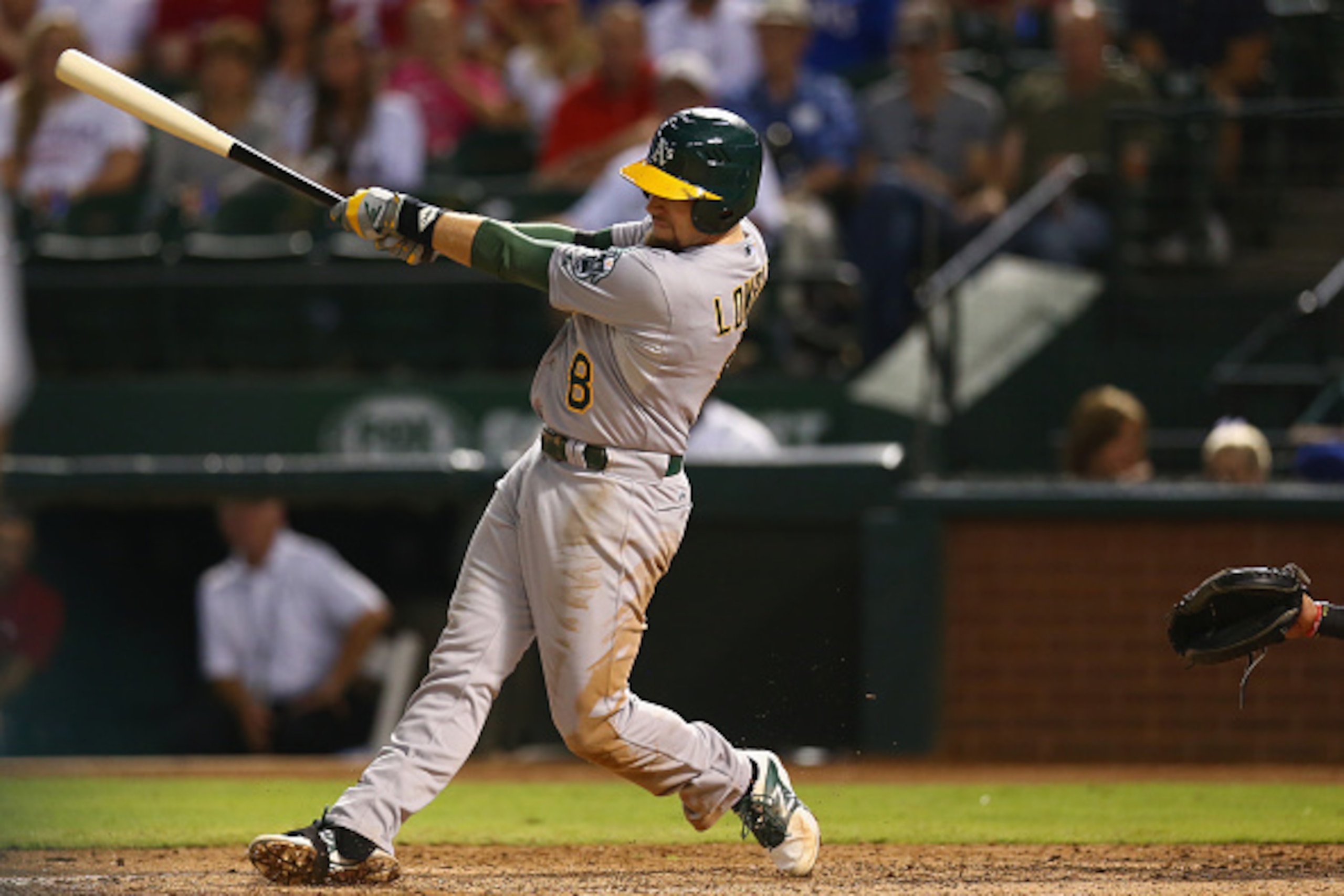 ARLINGTON, TX - SEPTEMBER 26:  Jed Lowrie #8 of the Oakland Athletics hits a one run double against the Texas Rangers in the 5th inning at Globe Life Park in Arlington on September 26, 2014 in Arlington, Texas.  (Photo by Ronald Martinez/Getty Images)