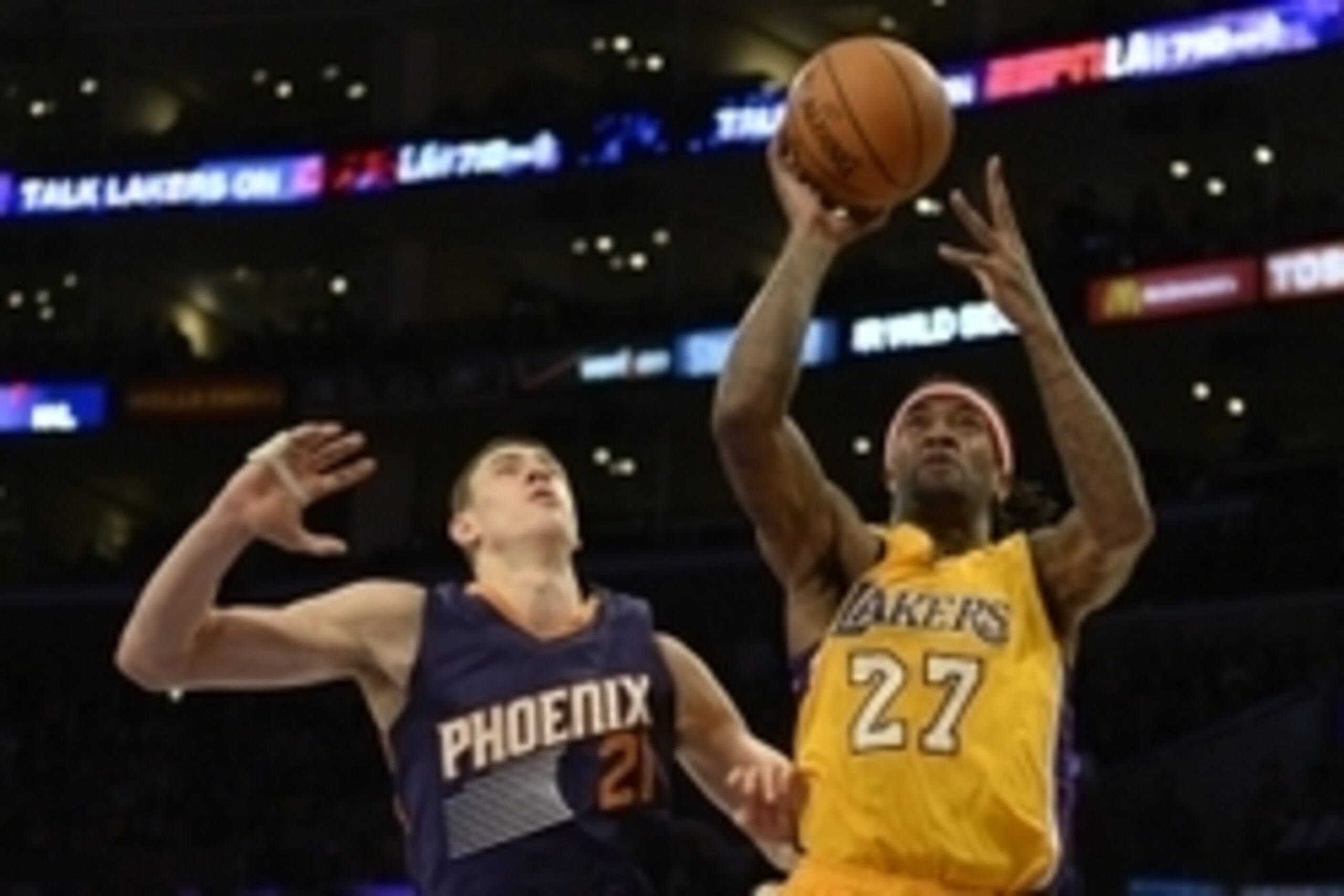Nov 4, 2014; Los Angeles, CA, USA; Los Angeles Lakers forward Jordan Hill (27) shoots the basketball against Phoenix Suns center Alex Len (21) during the second half at Staples Center. Mandatory Credit: Richard Mackson-USA TODAY Sports