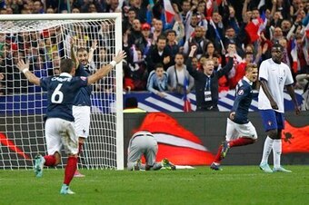 Cabaye celebrates with his France teammates.