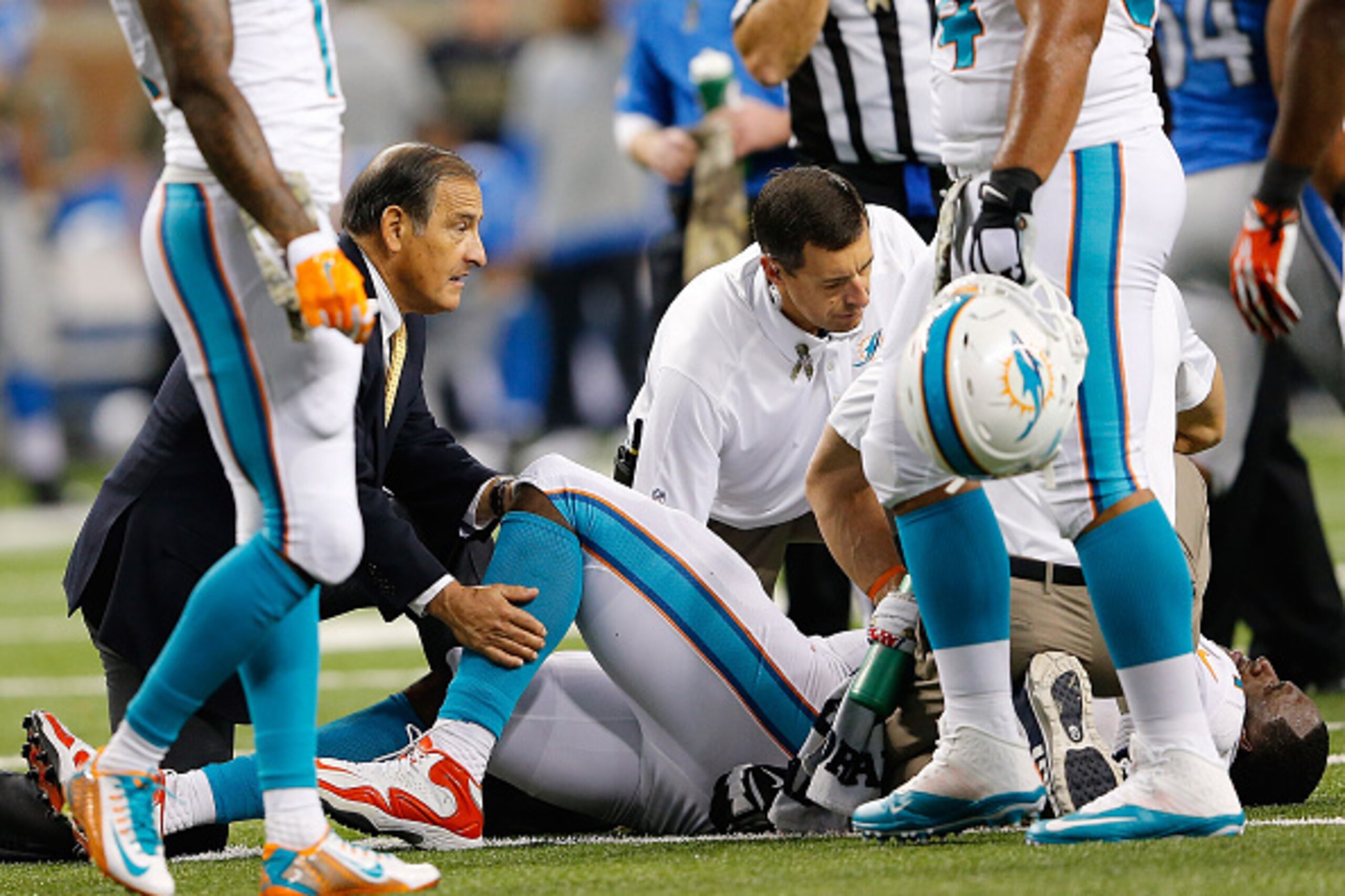DETROIT, MI - NOVEMBER 09: Branden Albert #71 of the Miami Dolphins is treated by the medical staff during the second quarter of the game against the Detroit Lions at Ford Field on November 09 , 2014 in Detroit, Michigan. (Photo by Leon Halip/Getty Images