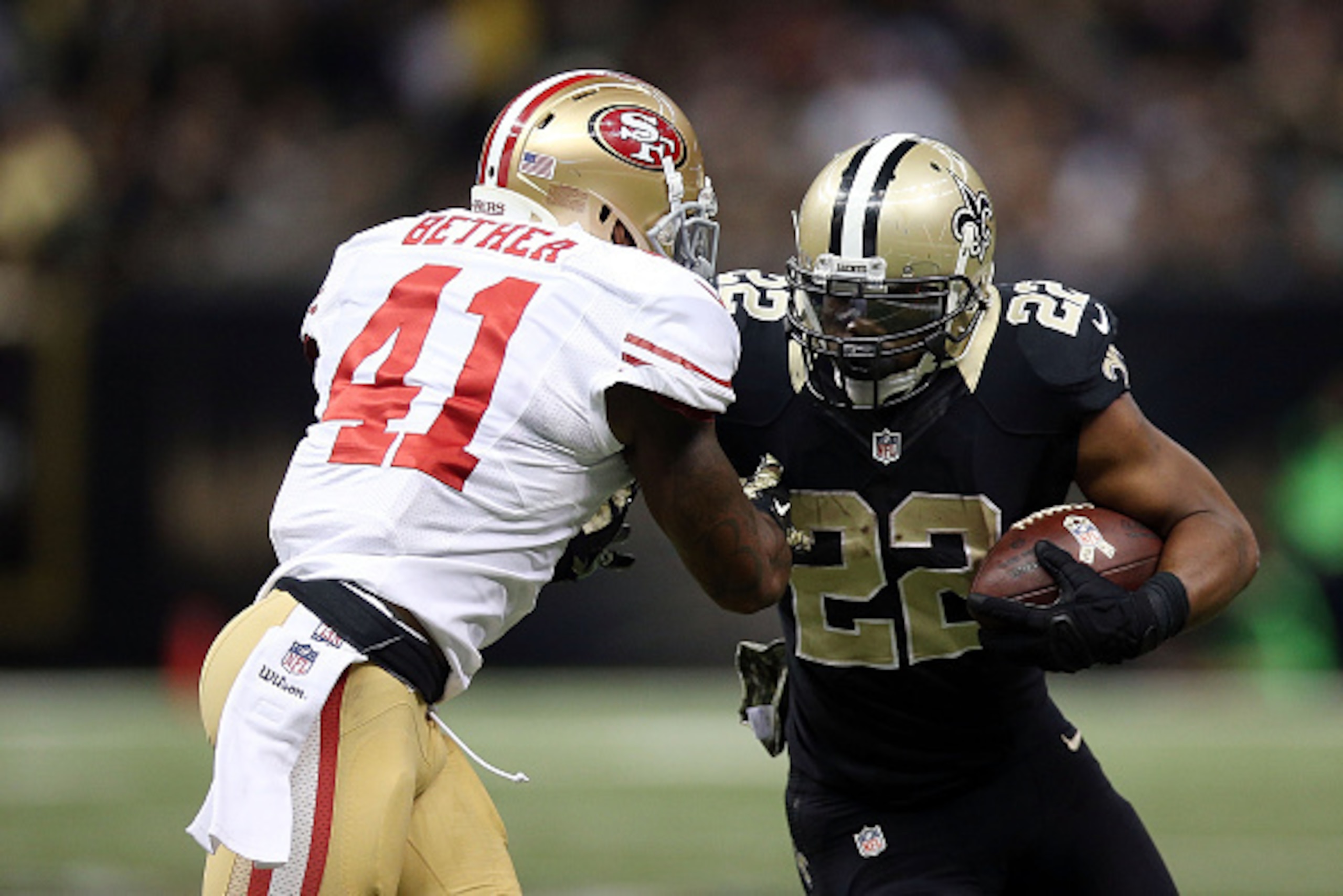NEW ORLEANS, LA - NOVEMBER 09:  Mark Ingram #22 of the New Orleans Saints is pursued by Antoine Bethea #41 of the San Francisco 49ers during the third quarter of a game at the Mercedes-Benz Superdome on November 9, 2014 in New Orleans, Louisiana.  (Photo 