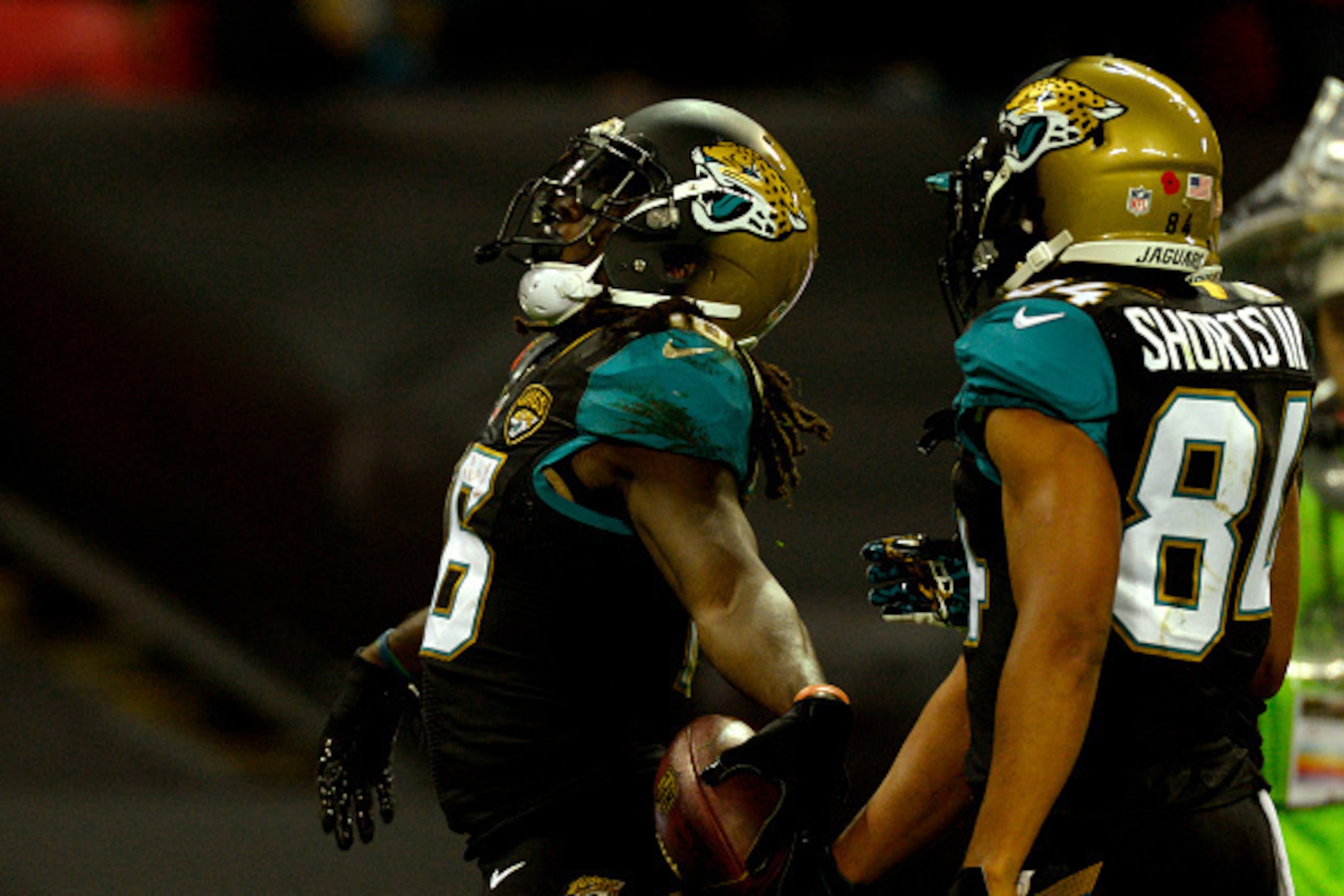 LONDON, ENGLAND - NOVEMBER 09:  Denard Robinson (L) #16 of the Jacksonville Jaguars celebrates after scoring the opening touchdown during the NFL week 10 match between the Jackson Jaguars and the Dallas Cowboys at Wembley Stadium on November 9, 2014 in Lo