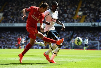 LONDON, ENGLAND - AUGUST 31:  Emmanuel Adebayour of Spurs and Javi Manquillo of Liverpool battle for the ba;; during the Barclays Premier League match between Tottenham Hotspur and Liverpool at White Hart Lane on August 31, 2014 in London, England.  (Phot
