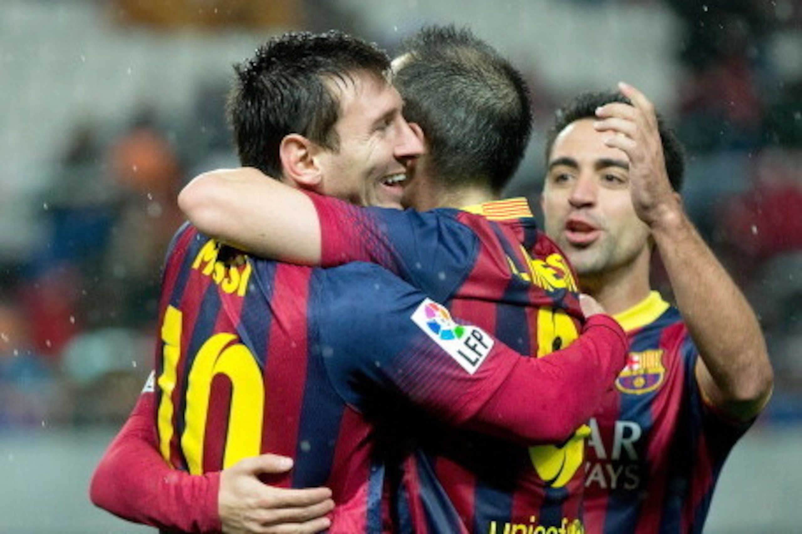 SEVILLE, SPAIN - FEBRUARY 09:  Lionel Messi (L) of FC Barcelona celebrates scoring their third goal with teammates Andres Iniesta (2ndL), Pedro Rodriguez Ledesma (2ndR) and Xavi Hernandez (R) during the La Liga match between Sevilla FC and FC Barcelona at