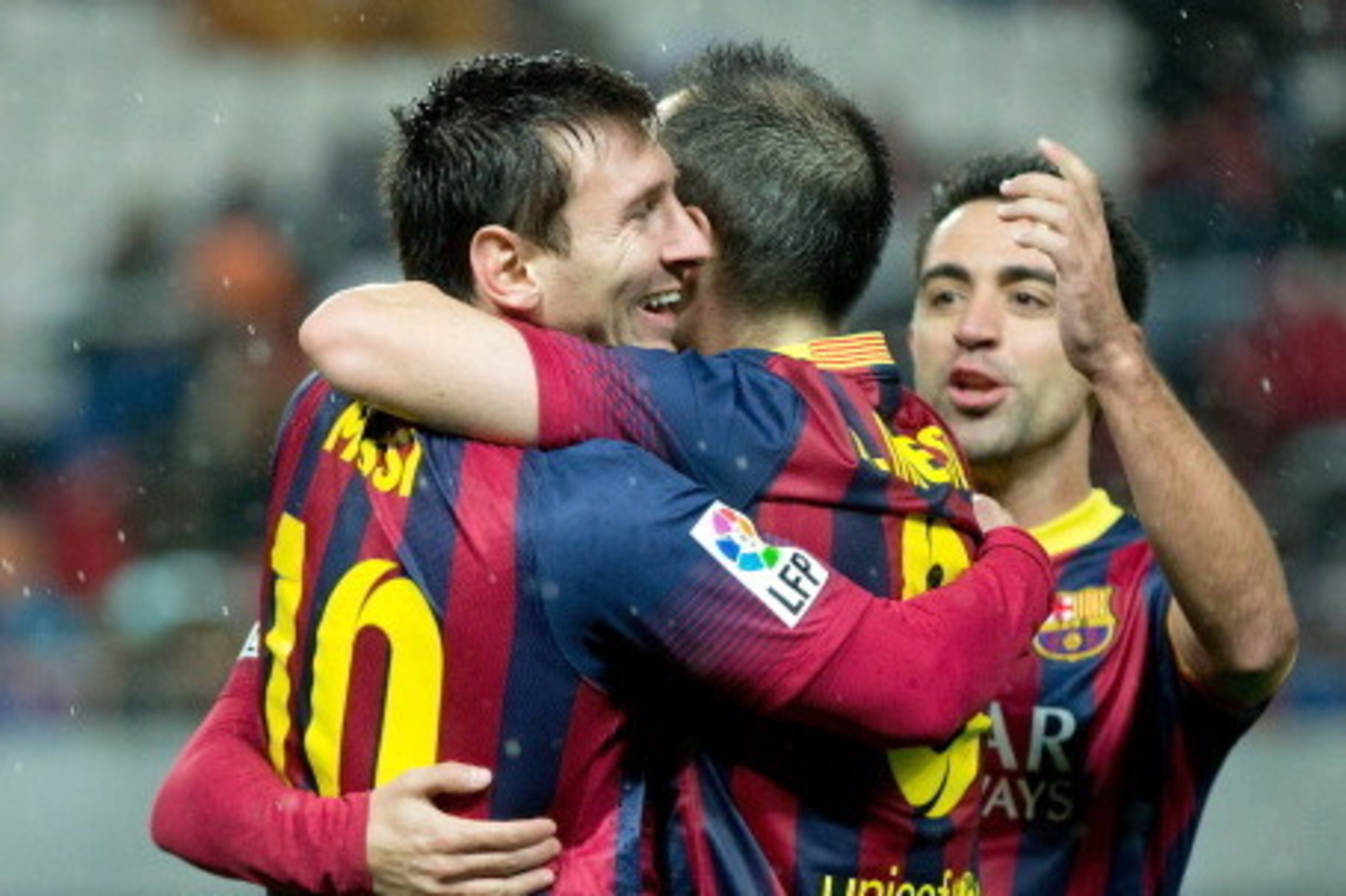 SEVILLE, SPAIN - FEBRUARY 09:  Lionel Messi (L) of FC Barcelona celebrates scoring their third goal with teammates Andres Iniesta (2ndL), Pedro Rodriguez Ledesma (2ndR) and Xavi Hernandez (R) during the La Liga match between Sevilla FC and FC Barcelona at