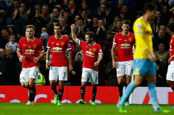 MANCHESTER, ENGLAND - NOVEMBER 08:  Juan Mata of Manchester United celebrates scoring the first goal during the Barclays Premier League match between Manchester United and Crystal Palace at Old Trafford on November 8, 2014 in Manchester, England.  (Photo 