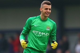 MANCHESTER, ENGLAND - OCTOBER 02:  Angus Gunn of Manchester City celebrates his team scoring a goal during the UEFA Youth Champions League match between Manchester City and FC Bayern Muenchen at Ewen Fields on October 2, 2013 in Manchester, England.  (Pho