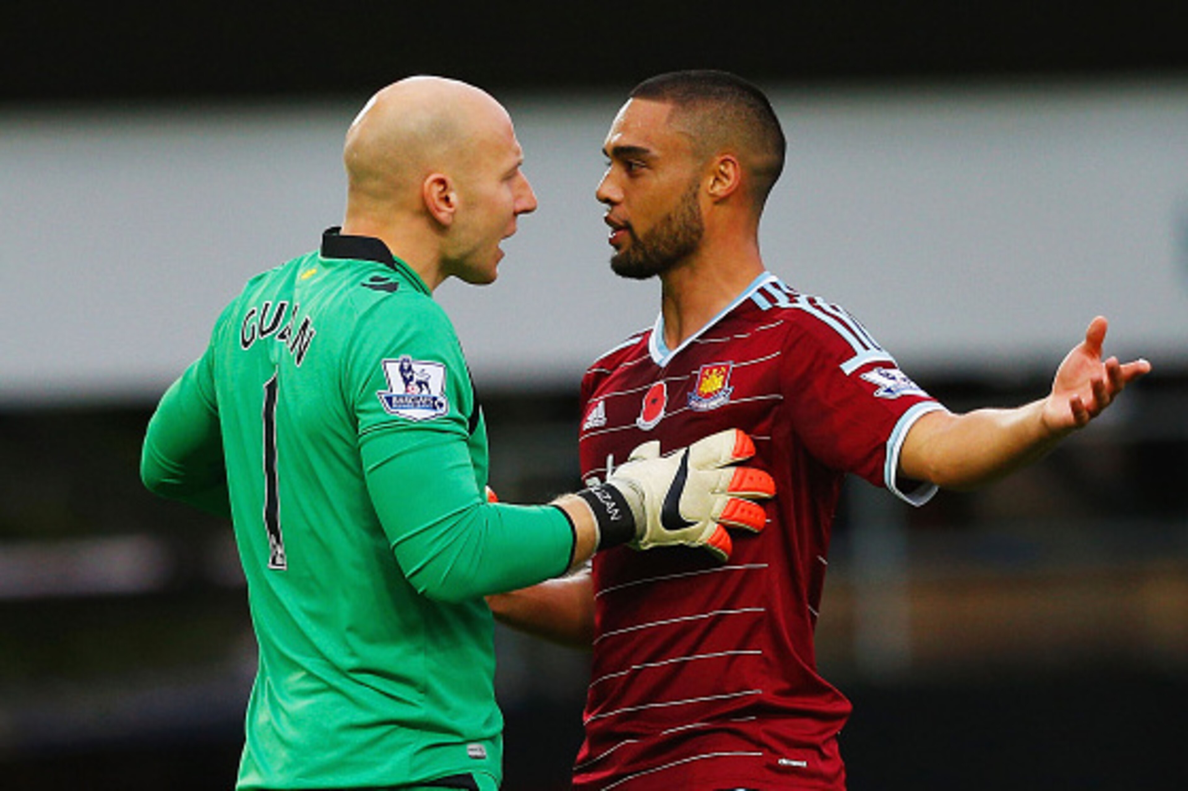 LONDON, ENGLAND - NOVEMBER 08:  Brad Guzan of Aston Villa and Winston Reid of West Ham United clash during the Barclays Premier League match between West Ham United and Aston Villa at Boleyn Ground on November 8, 2014 in London, England.  (Photo by Harry 