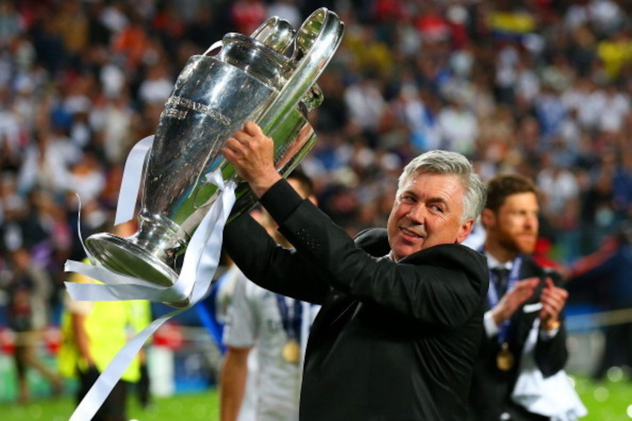LISBON, PORTUGAL - MAY 24:  Head Coach, Carlo Ancelotti of Real Madrid celebrates with the Champions League trophy during the UEFA Champions League Final between Real Madrid and Atletico de Madrid at Estadio da Luz on May 24, 2014 in Lisbon, Portugal.  (P