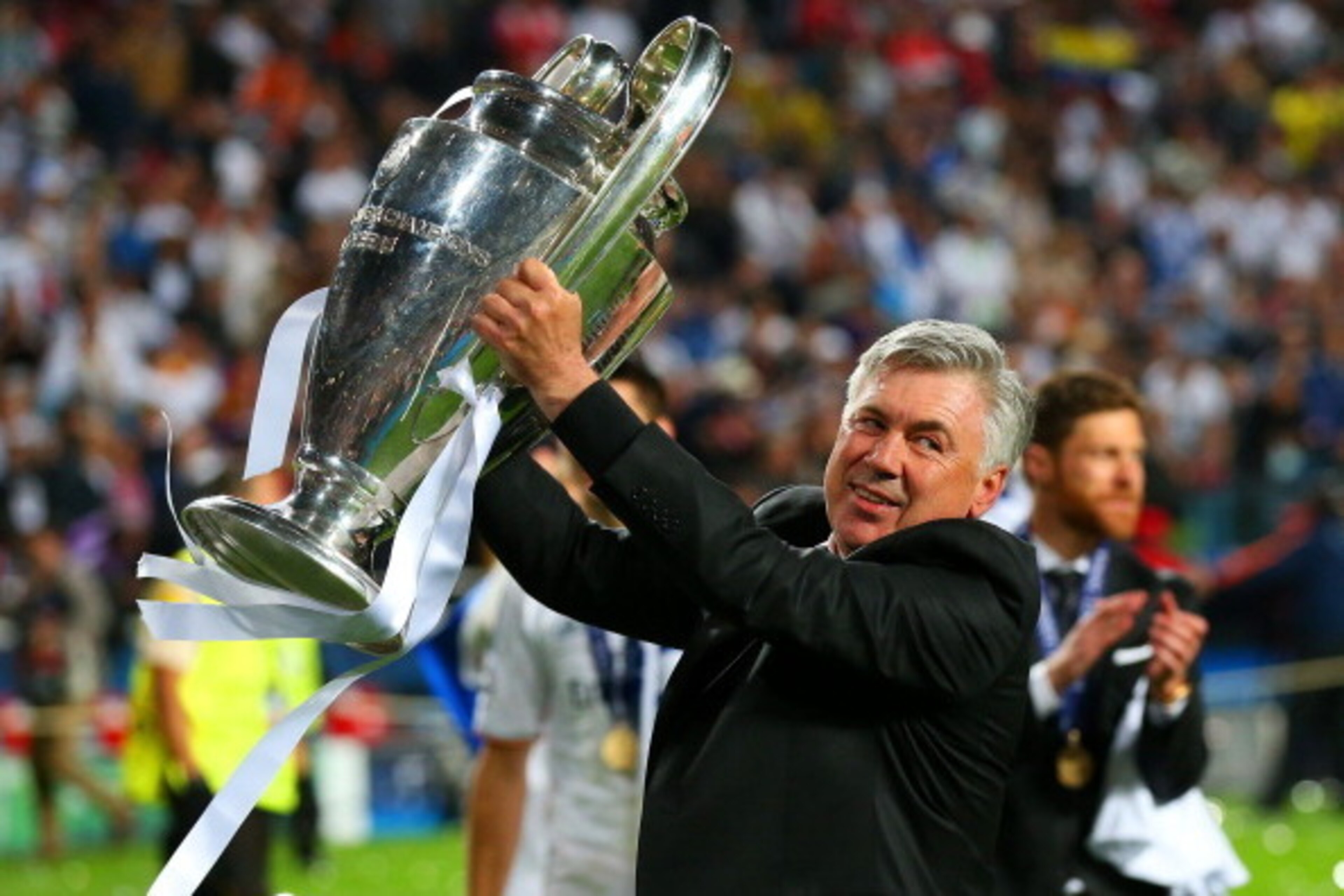 LISBON, PORTUGAL - MAY 24:  Head Coach, Carlo Ancelotti of Real Madrid celebrates with the Champions League trophy during the UEFA Champions League Final between Real Madrid and Atletico de Madrid at Estadio da Luz on May 24, 2014 in Lisbon, Portugal.  (P