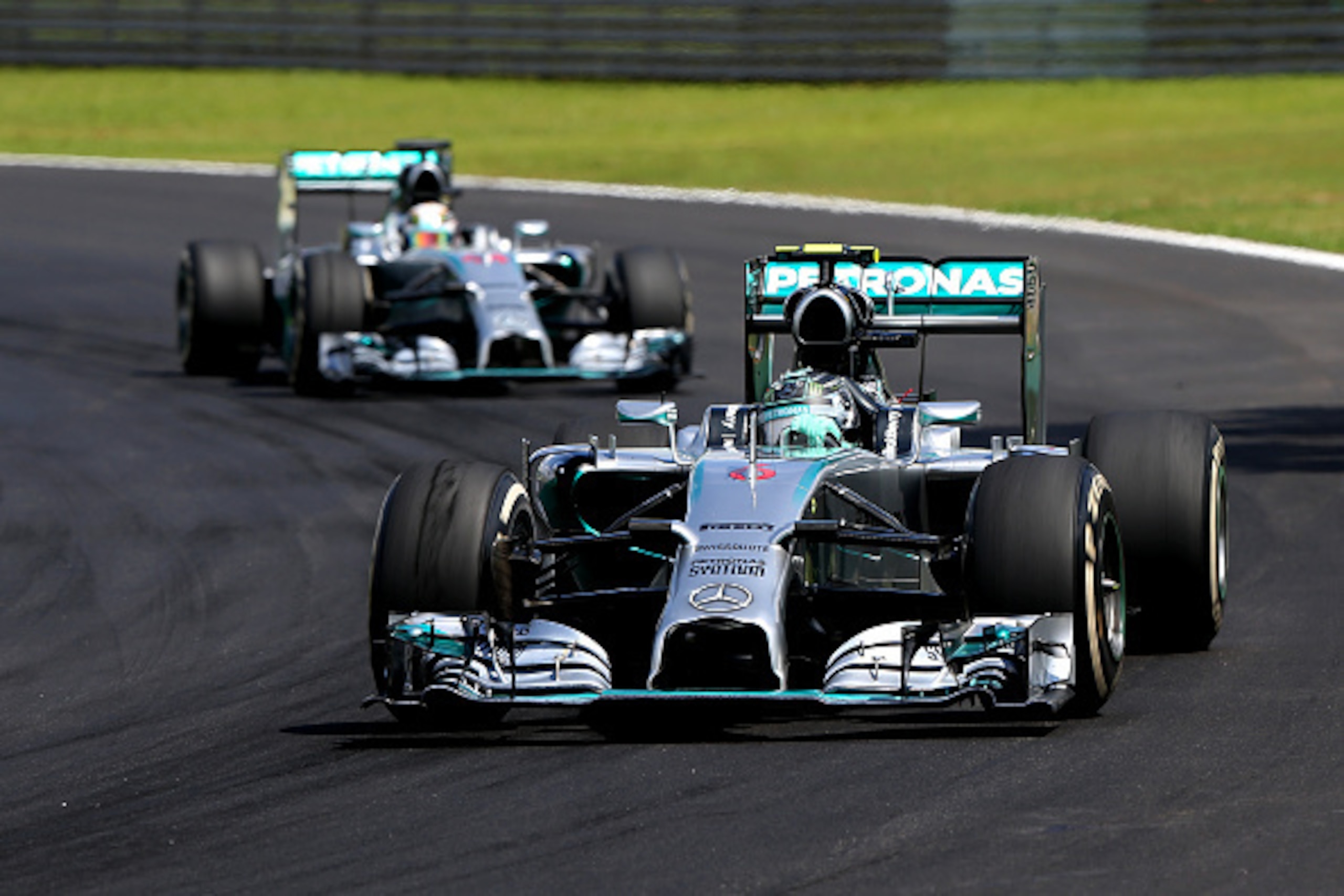 SAO PAULO, BRAZIL - NOVEMBER 09:  Nico Rosberg of Germany and Mercedes GP leads Lewis Hamilton of Great Britain and Mercedes GP during the Brazilian Formula One Grand Prix at Autodromo Jose Carlos Pace on November 9, 2014 in Sao Paulo, Brazil.  (Photo by 