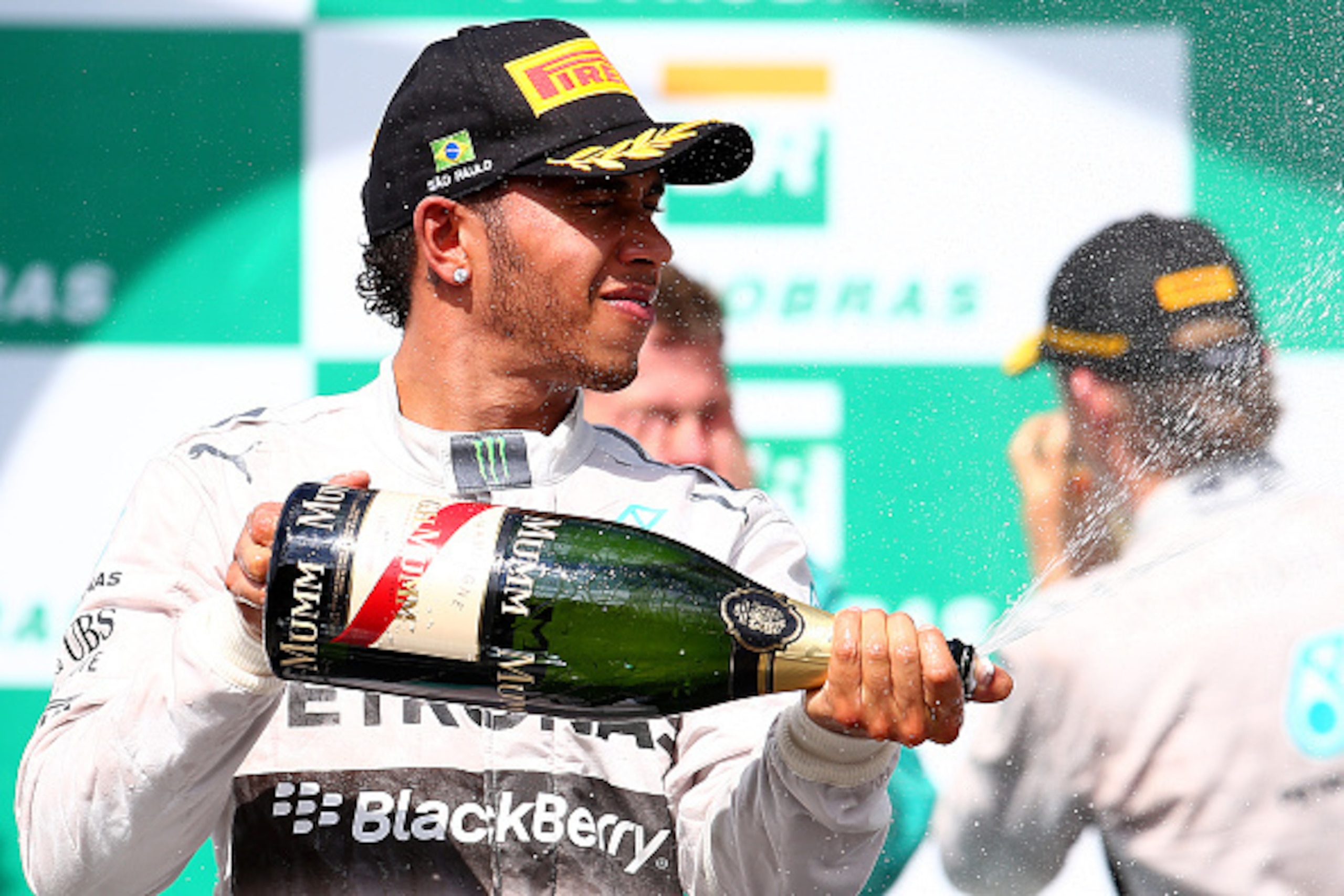 SAO PAULO, BRAZIL - NOVEMBER 09:  Lewis Hamilton of Great Britain and Mercedes GP celebrates on the podium after finishing second in the Brazilian Formula One Grand Prix at Autodromo Jose Carlos Pace on November 9, 2014 in Sao Paulo, Brazil.  (Photo by Ma