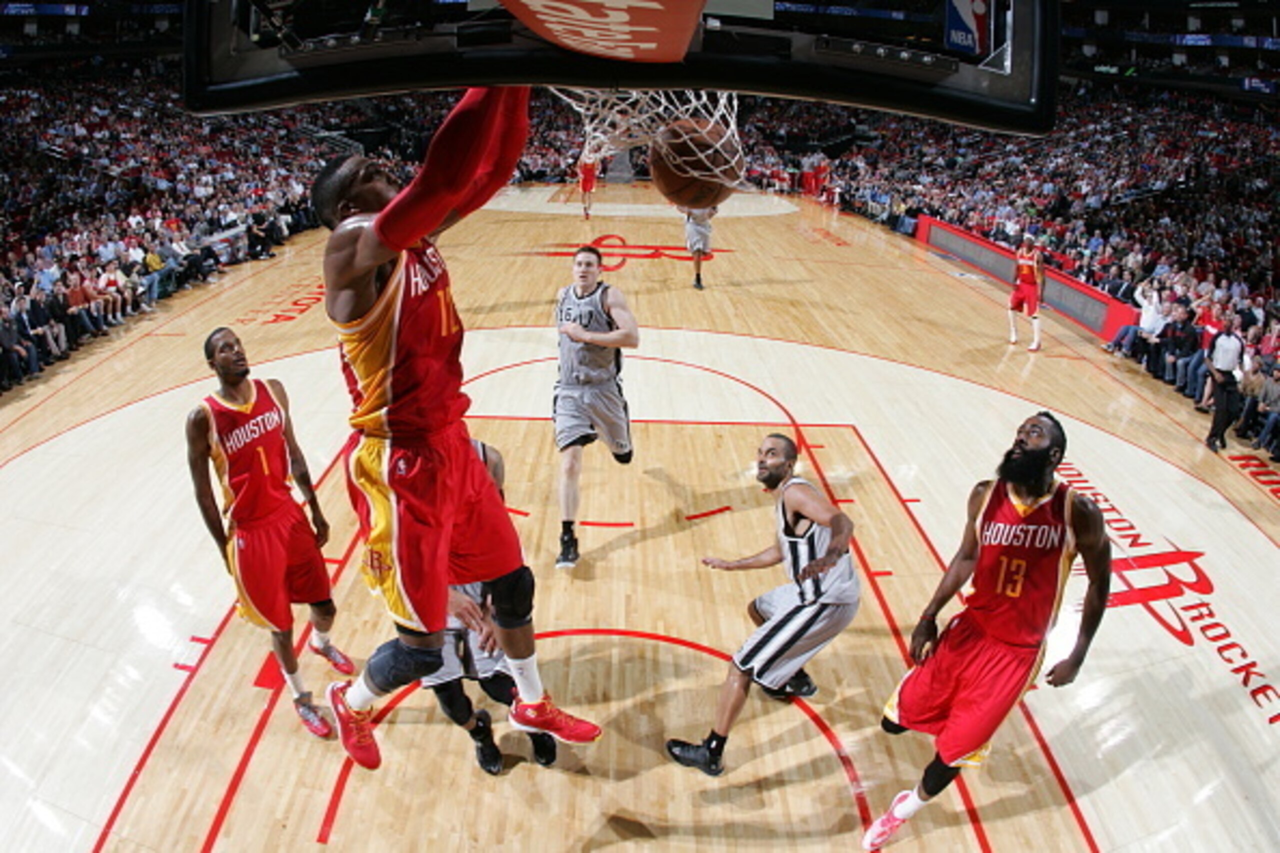 HOUSTON, TX - NOVEMBER 6:  Dwight Howard #12 of the Hosuton Rockets dunks against the San Antonio Spurs on November 6, 2014 at the Toyota Center in Houston, Texas. NOTE TO USER: User expressly acknowledges and agrees that, by downloading and or using this