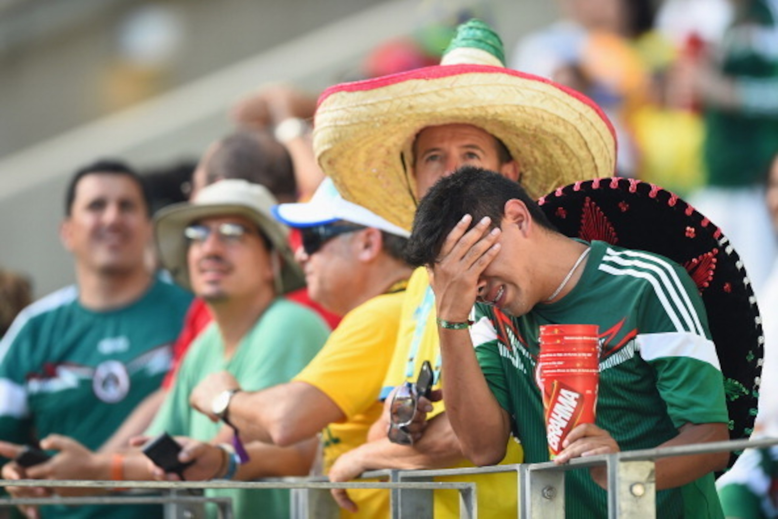 FORTALEZA, BRAZIL - JUNE 29:  A Mexican fan shows his dispair after the 2014 FIFA World Cup Brazil Round of 16 match between Netherlands and Mexico at Castelao on June 29, 2014 in Fortaleza, Brazil.  (Photo by Laurence Griffiths/Getty Images)