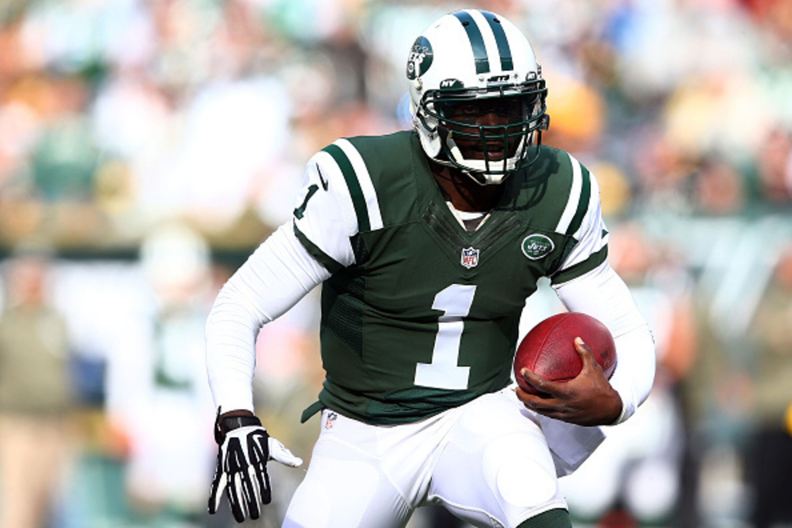 EAST RUTHERFORD, NJ - NOVEMBER 09:  Quarterback Michael Vick #1 of the New York Jets runs with the ball against the Pittsburgh Steelers during a game at MetLife Stadium on November 9, 2014 in East Rutherford, New Jersey.  (Photo by Elsa/Getty Images)
