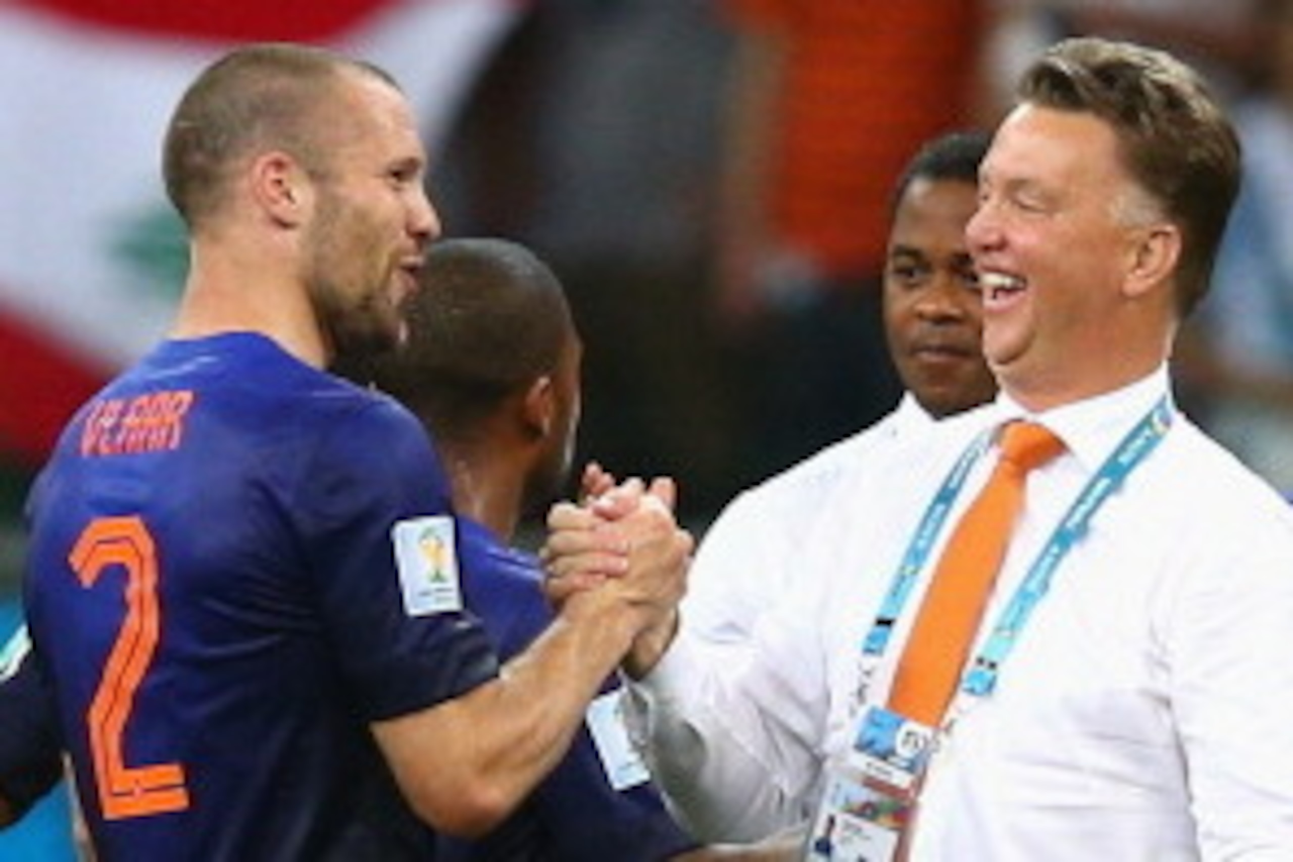 SALVADOR, BRAZIL - JUNE 13: Ron Vlaar and head coach Louis van Gaal of the Netherlands celebrate victory after the 2014 FIFA World Cup Brazil Group B match between Spain and Netherlands at Arena Fonte Nova on June 13, 2014 in Salvador, Brazil.  (Photo by