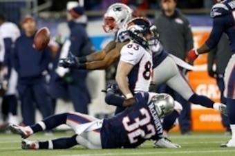 Nov 2, 2014; Foxborough, MA, USA; New England Patriots free safety Devin McCourty (32) breaks up a pass intended for Denver Broncos wide receiver Wes Welker (83) and intercepted by cornerback Brandon Browner (39) during the third quarter at Gillette Stadi