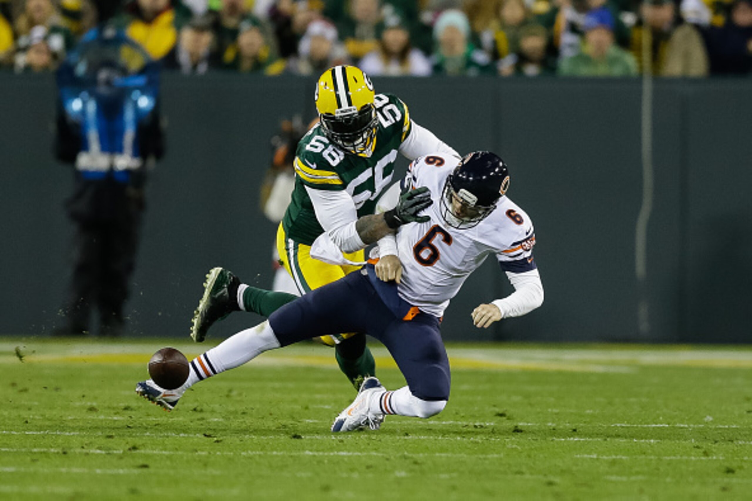 GREEN BAY, WI - NOVEMBER 9:  Julius Peppers #56 of the Green Bay Packers sacks quarterback Jay Cutler #6 of the Chicago Bears, resulting in an interception late in the second quarter, during the NFL game at Lambeau Field on November 09, 2014 in Green Bay,