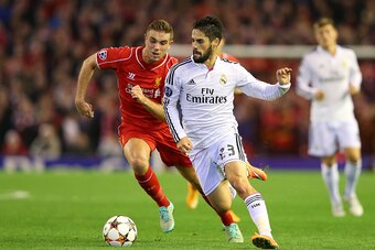 LIVERPOOL, ENGLAND - OCTOBER 22:  Isco of Real Madrid competes with Jordan Henderson of Liverpool during the UEFA Champions League Group B match between Liverpool and Real Madrid CF on October 22, 2014 in Liverpool, United Kingdom.  (Photo by Alex Livesey
