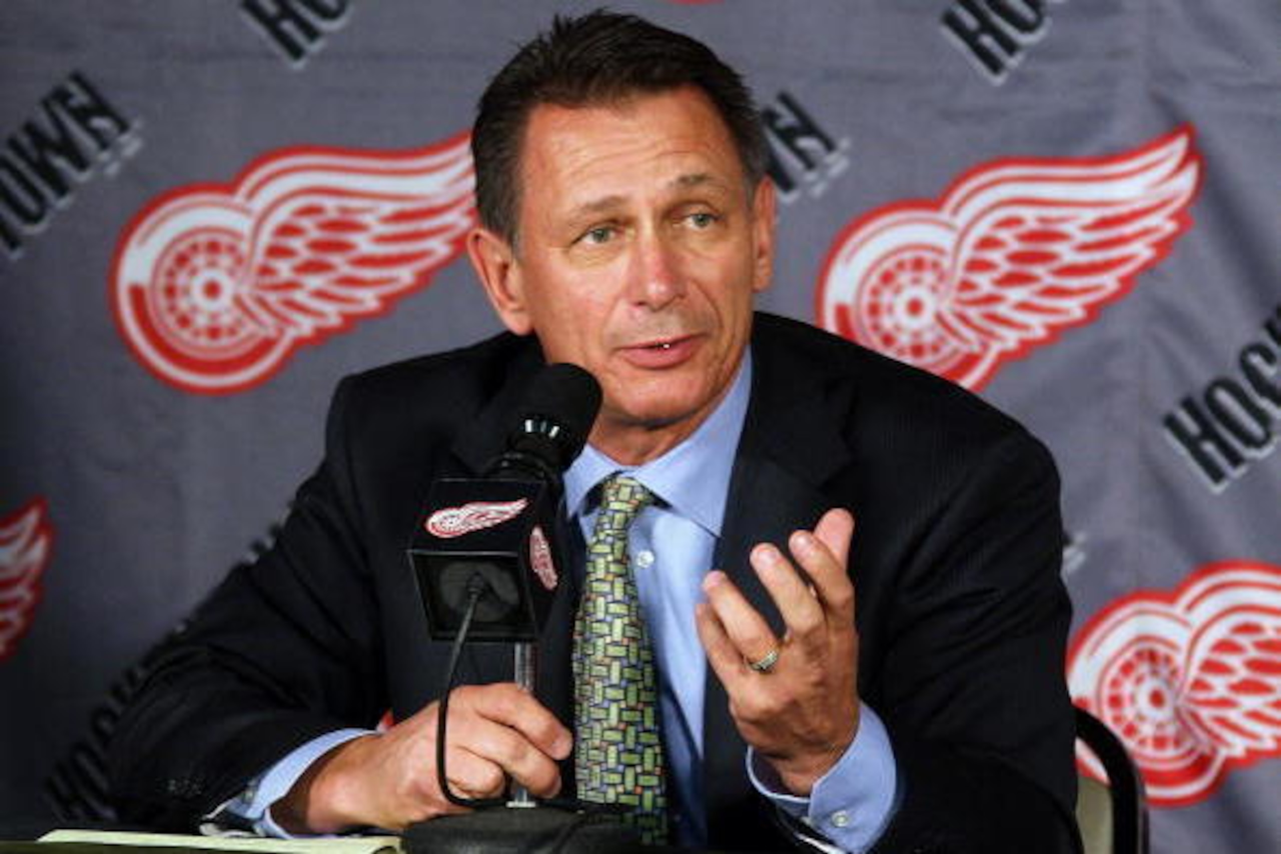 DETROIT - OCTOBER 12:  Executive Vice President and General Manager, Ken Holland of the Detroit Red Wings address the media during a press conference to announce the retirement from hockey of Kirk Maltby #18 before a NHL game against the Colorado Avalanch