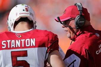 DENVER, CO - OCTOBER 05:  Head coach Bruce Arians of the Arizona Cardinals talks to quarterback Drew Stanton #5 of the Arizona Cardinals as they face the Denver Broncos at Sports Authority Field at Mile High on October 5, 2014 in Denver, Colorado. The Bro