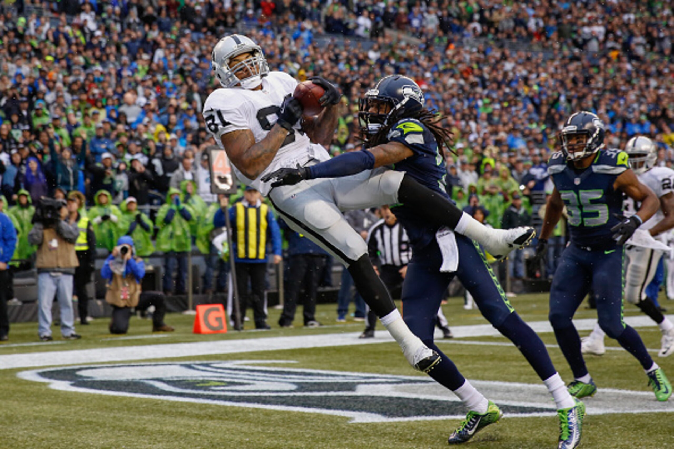 SEATTLE, WA - NOVEMBER 02: Tight end Mychal Rivera #81 of the Oakland Raiders makes a touchdown catch against cornerback Richard Sherman #25 of the Seattle Seahawks in the third quarter at CenturyLink Field on November 2, 2014 in Seattle, Washington. The SEATTLE, WA - NOVEMBER 02: Tight end Mychal Rivera #81 of the Oakland Raiders makes a touchdown catch against cornerback Richard Sherman #25 of the Seattle Seahawks in the third quarter at CenturyLink Field on November 2, 2014 in Seattle, Washington. The