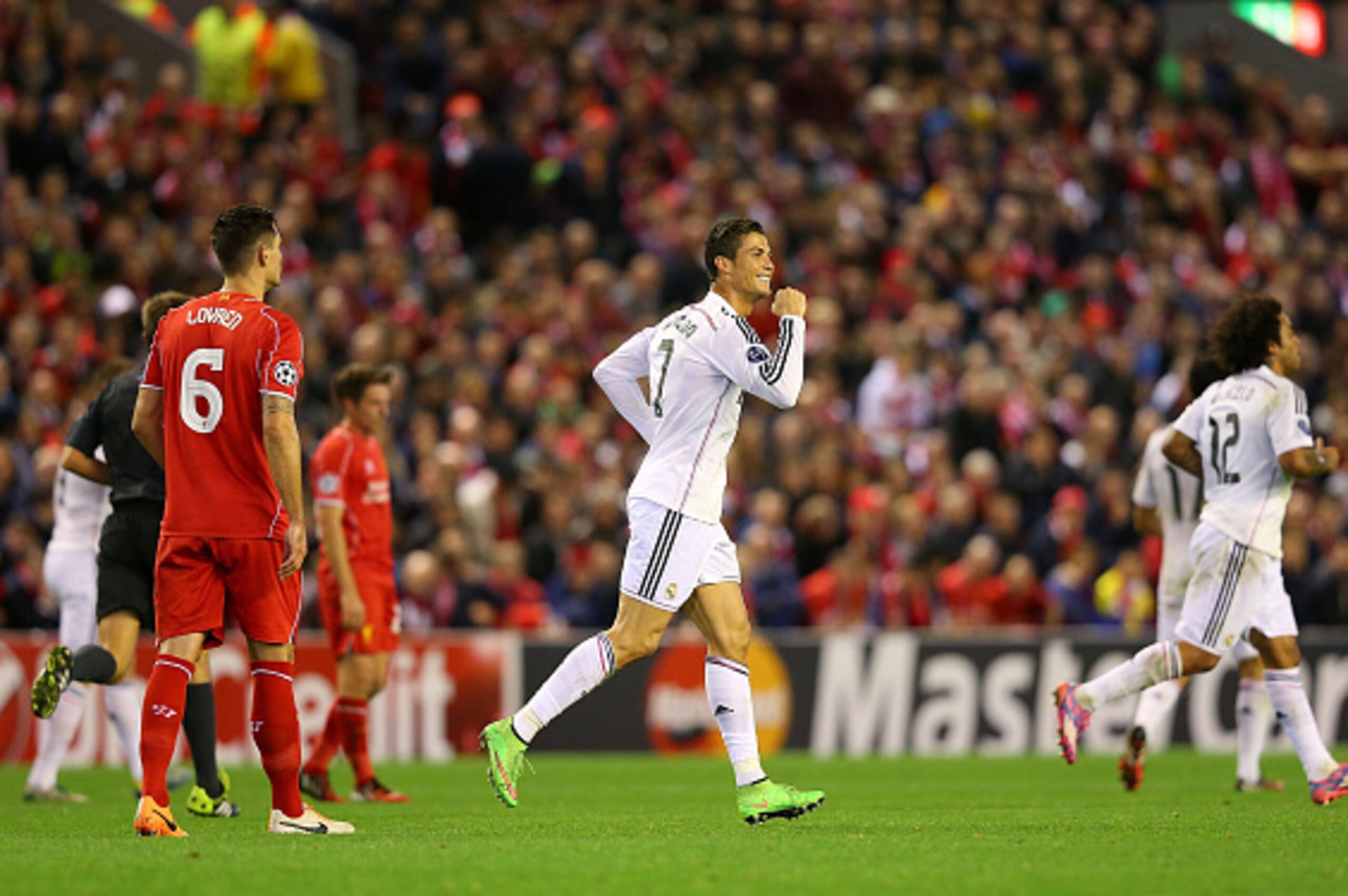 LIVERPOOL, ENGLAND - OCTOBER 22:  Cristiano Ronaldo of Real Madrid celebrates scoring the opening goal during the UEFA Champions League Group B match between Liverpool and Real Madrid CF on October 22, 2014 in Liverpool, United Kingdom.  (Photo by Alex Li