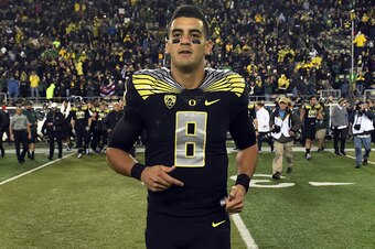 EUGENE, OR - NOVEMBER 1: Quarterback Marcus Mariota #8 of the Oregon Ducks runs out onto the field after the game against the Stanford Cardinal at Autzen Stadium on November 1, 2014 in Eugene, Oregon. Oregon won the game 45-16.(Photo by Steve Dykes/Getty 