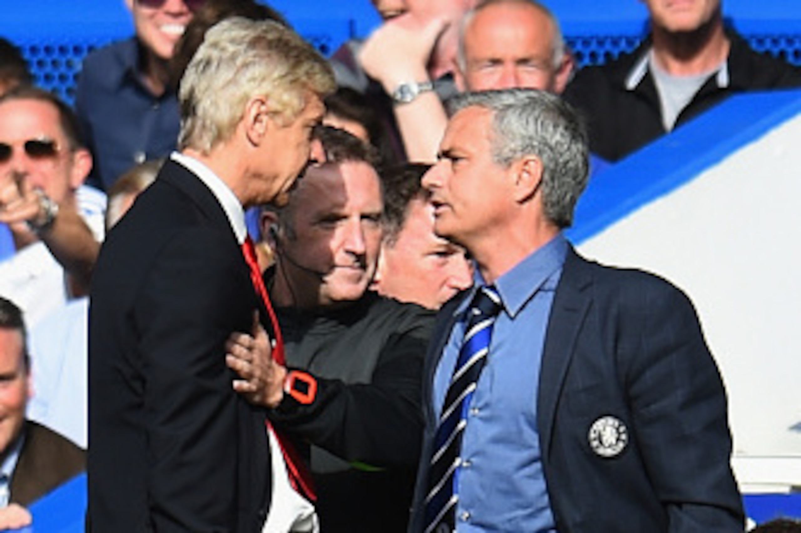 LONDON, ENGLAND - OCTOBER 05: Fourth Official Jonathan Moss comes between Managers Arsene Wenger of Arsenal and Jose Mourinho manager of Chelsea during the Barclays Premier League match between Chelsea and Arsenal at Stamford Bridge on October 4, 2014 in LONDON, ENGLAND - OCTOBER 05: Fourth Official Jonathan Moss comes between Managers Arsene Wenger of Arsenal and Jose Mourinho manager of Chelsea during the Barclays Premier League match between Chelsea and Arsenal at Stamford Bridge on October 4, 2014 in