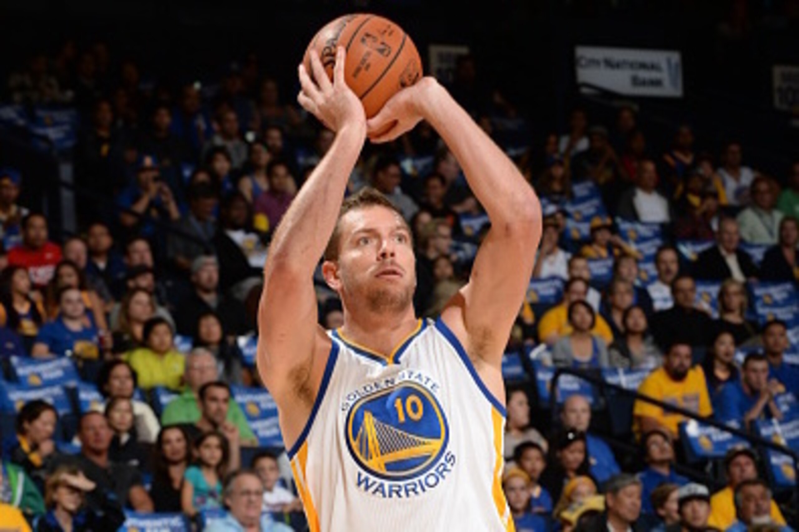 Oakland, CA- OCTOBER 24: David Lee #10 of the Golden State Warriors takes a shot against the Denver Nuggets at the Oracle Arena in Oakland, California on October 24, 2014 . NOTE TO USER: User expressly acknowledges and agrees that, by downloading and/or u
