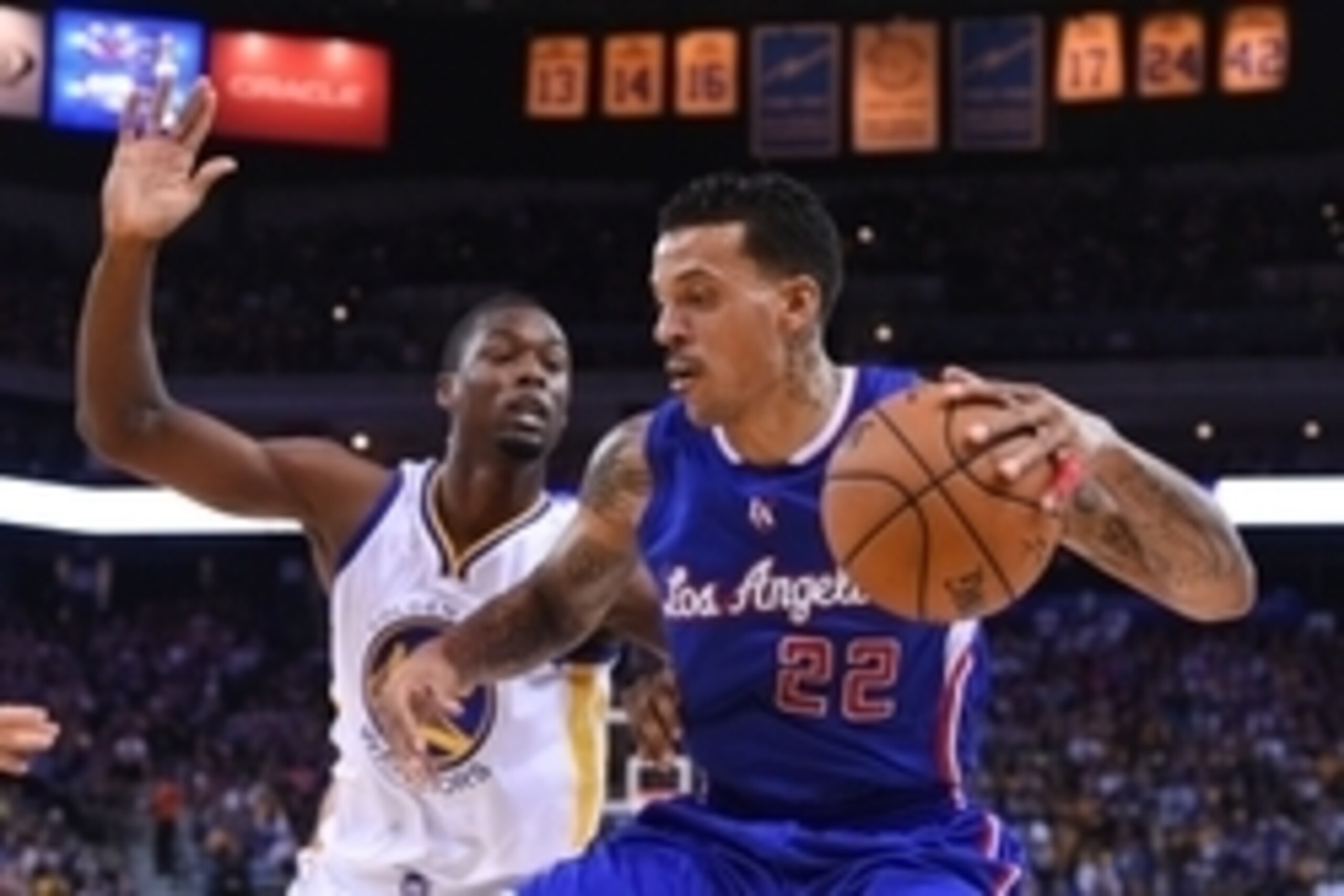 November 5, 2014; Oakland, CA, USA; Los Angeles Clippers forward Matt Barnes (22) dribbles the basketball against Golden State Warriors forward Harrison Barnes (40) during the second quarter at Oracle Arena. Mandatory Credit: Kyle Terada-USA TODAY Sports
