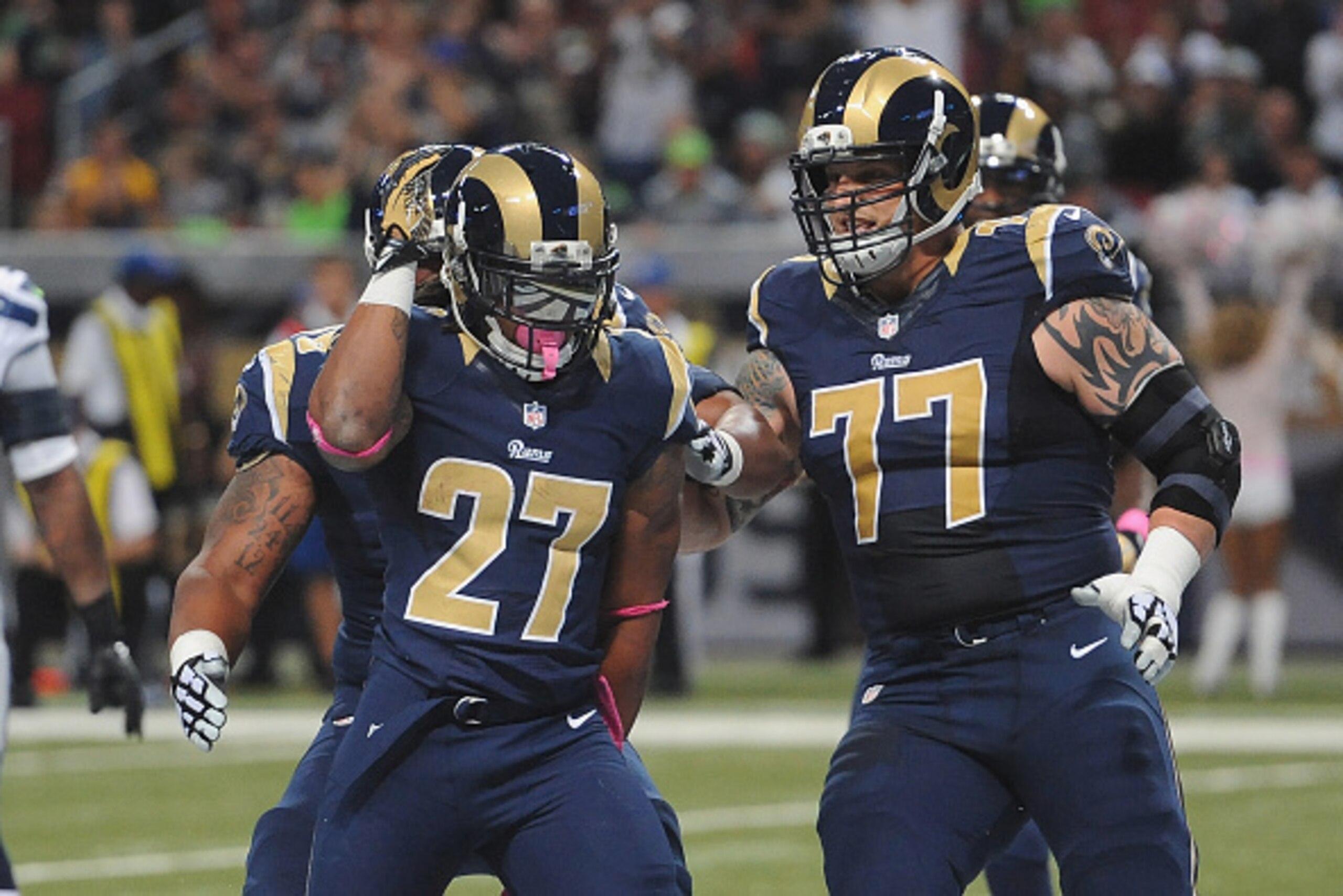 ST. LOUIS, MO - OCTOBER 19: Tre Mason #27 of the St. Louis Rams celebrates a first-quarter touchdown against the Seattle Seahawks at the Edward Jones Dome on October 19,  2014 in St. Louis, Missouri.  (Photo by Michael B. Thomas/Getty Images)