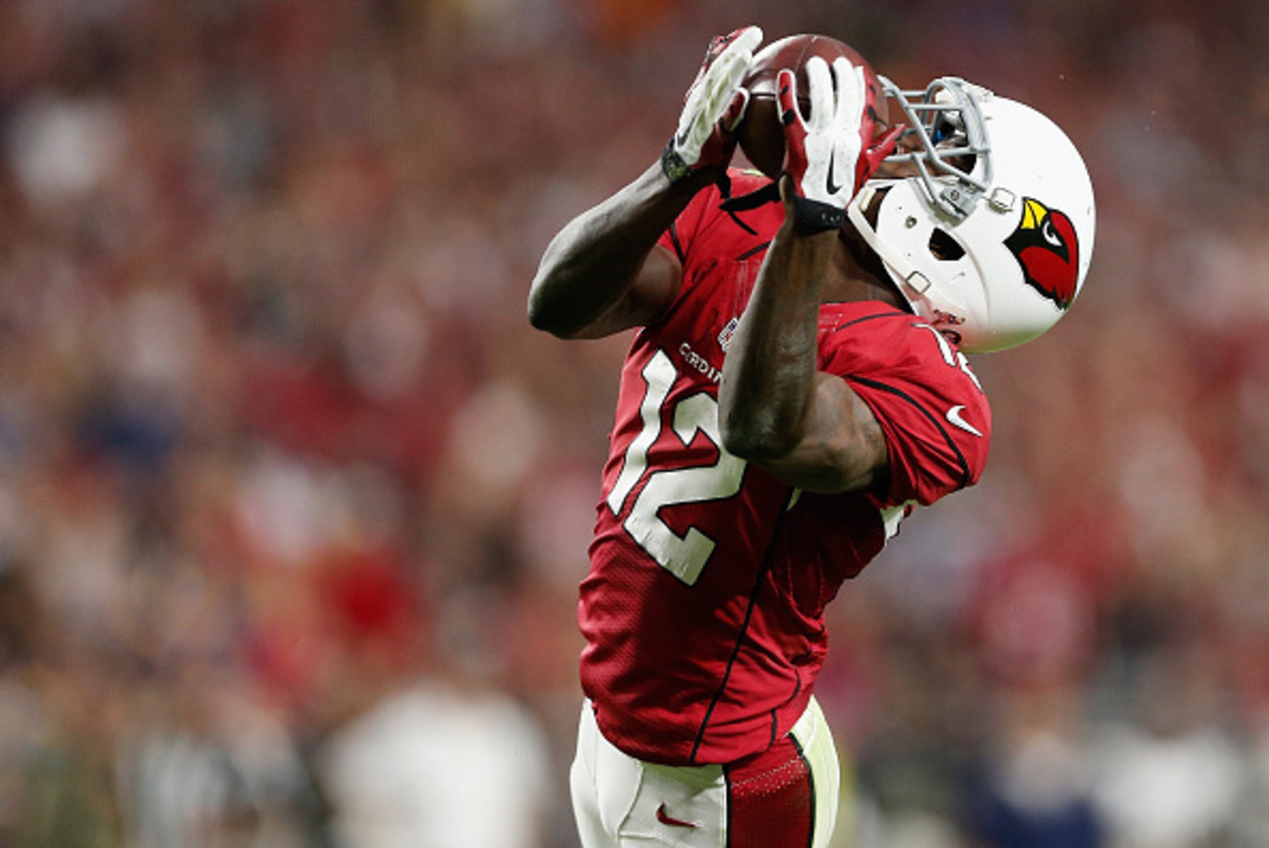 GLENDALE, AZ - NOVEMBER 09:  Wide receiver John Brown #12 of the Arizona Cardinals catches a 48-yard touchdown pass against the St. Louis Rams during the fourth quarter of the NFL game at the University of Phoenix Stadium on November 9, 2014 in Glendale, 