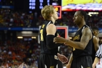 Apr 6, 2013; Atlanta, GA, USA; Wichita State Shockers guard Ron Baker (31) and guard Malcolm Armstead (2) react after losing the semifinals during the 2013 NCAA mens Final Four at the Georgia Dome.   Louisville Cardinals won 72-68. Mandatory Credit: Bob D