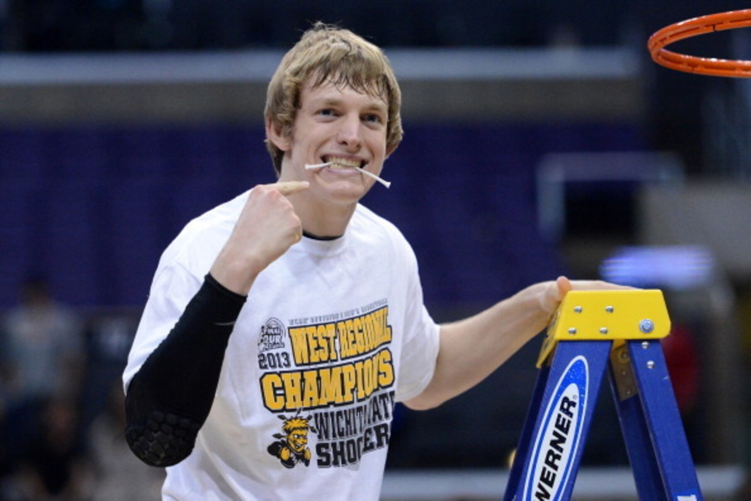 LOS ANGELES, CA - MARCH 30:  Ron Baker #31 of the Wichita State Shockers celebrates by cutting down the net after defeating the Ohio State Buckeyes 70-66 during the West Regional Final of the 2013 NCAA Men's Basketball Tournament at Staples Center on Marc