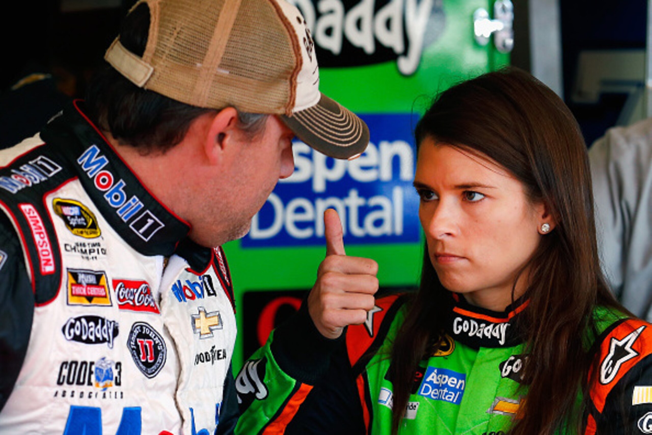 AVONDALE, AZ - NOVEMBER 08:  Tony Stewart, driver of the #14 Mobil 1/Bass Pro Shops Chevrolet, talks to Danica Patrick, driver of the #10 GoDaddy Chevrolet, in the garage area during practice for the NASCAR Sprint Cup Series Quicken Loans 500 at Phoenix I