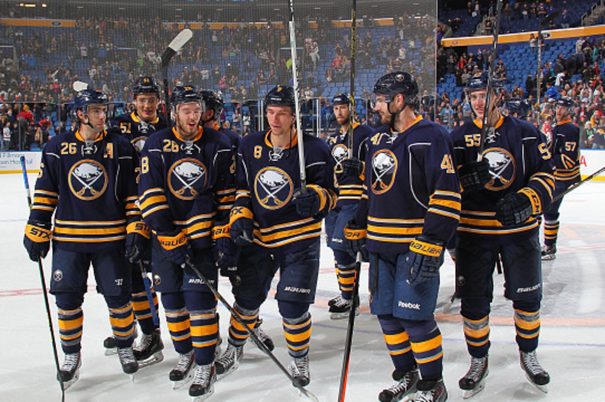 BUFFALO, NY - NOVEMBER 02: Buffalo Sabres players celebrates a victory against the Detroit Red Wings on November 2, 2014 at the First Niagara Center in Buffalo, New York.  (Photo by Bill Wippert/NHLI via Getty Images)