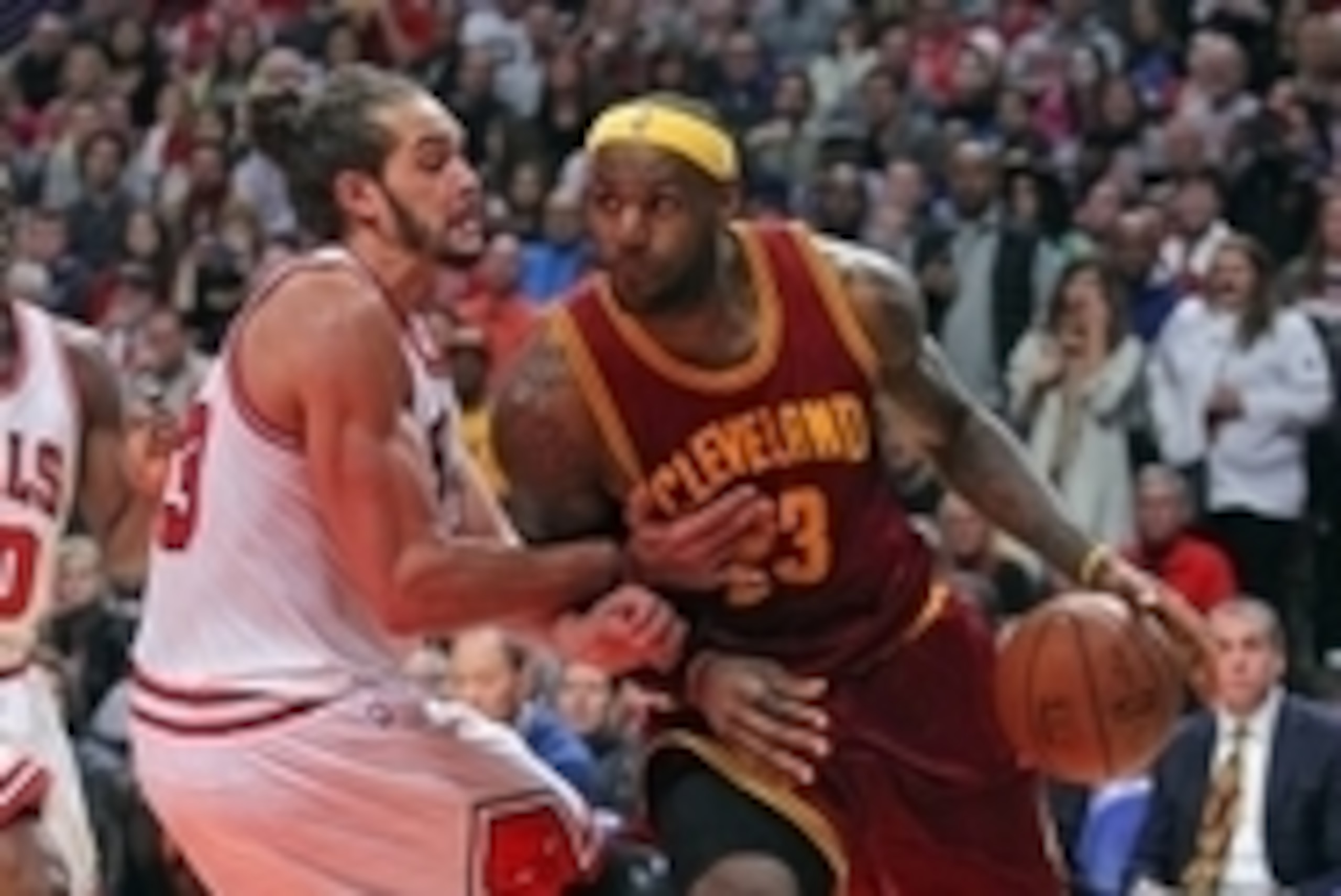Oct 31, 2014; Chicago, IL, USA; Cleveland Cavaliers forward LeBron James (23) is defended by Chicago Bulls center Joakim Noah (13) during the second half at the United Center. Cleveland won 114-108 in overtime. Mandatory Credit: Dennis Wierzbicki-USA TODA