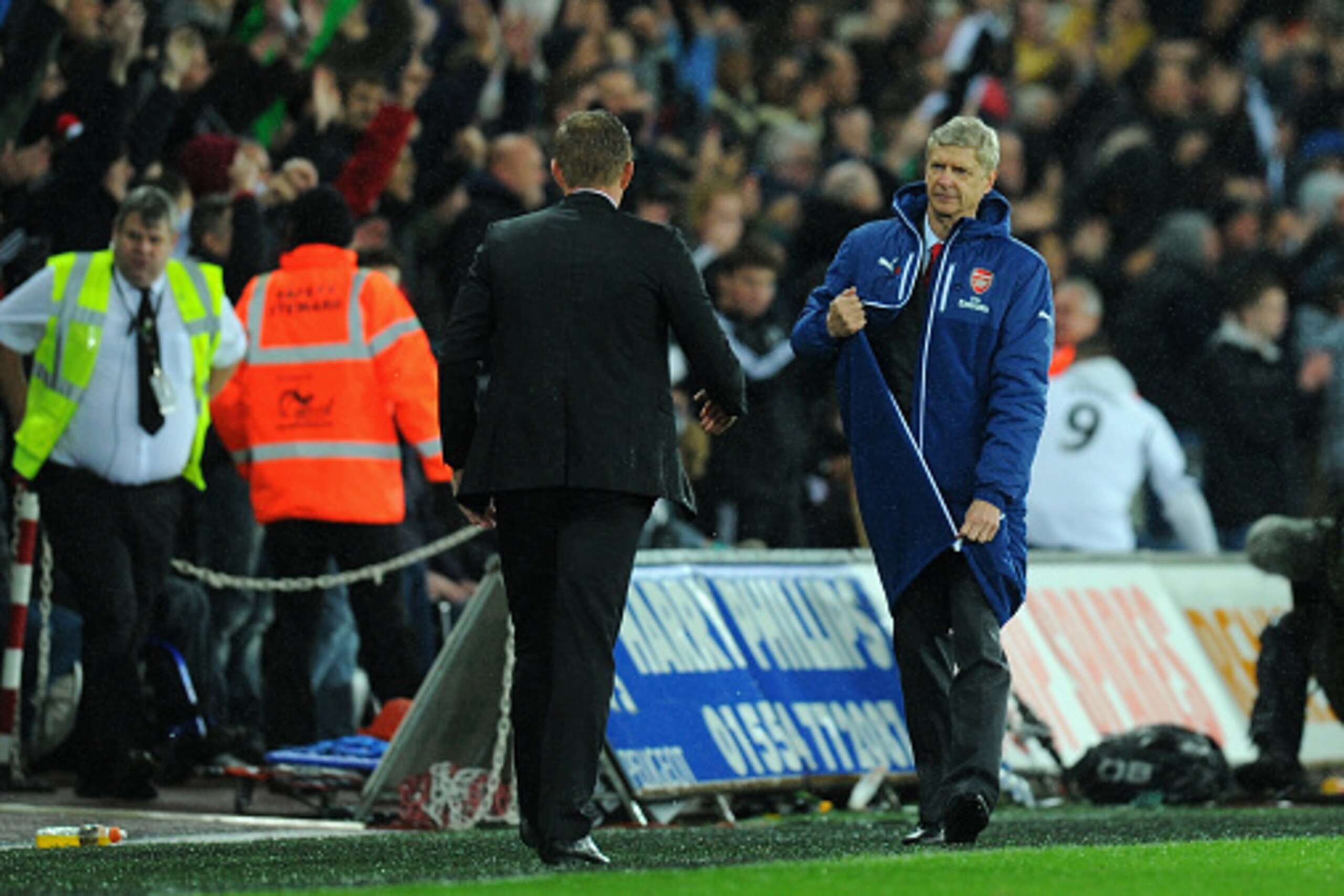SWANSEA, WALES - NOVEMBER 09: Arsenal manager Arsene Wenger (r) goes to congratulate Swansea manager Garry Monk on the final whistle during the Barclays Premier League match between Swansea City and Arsenal at Liberty Stadium on November 9, 2014 in Swans SWANSEA, WALES - NOVEMBER 09: Arsenal manager Arsene Wenger (r) goes to congratulate Swansea manager Garry Monk on the final whistle during the Barclays Premier League match between Swansea City and Arsenal at Liberty Stadium on November 9, 2014 in Swans