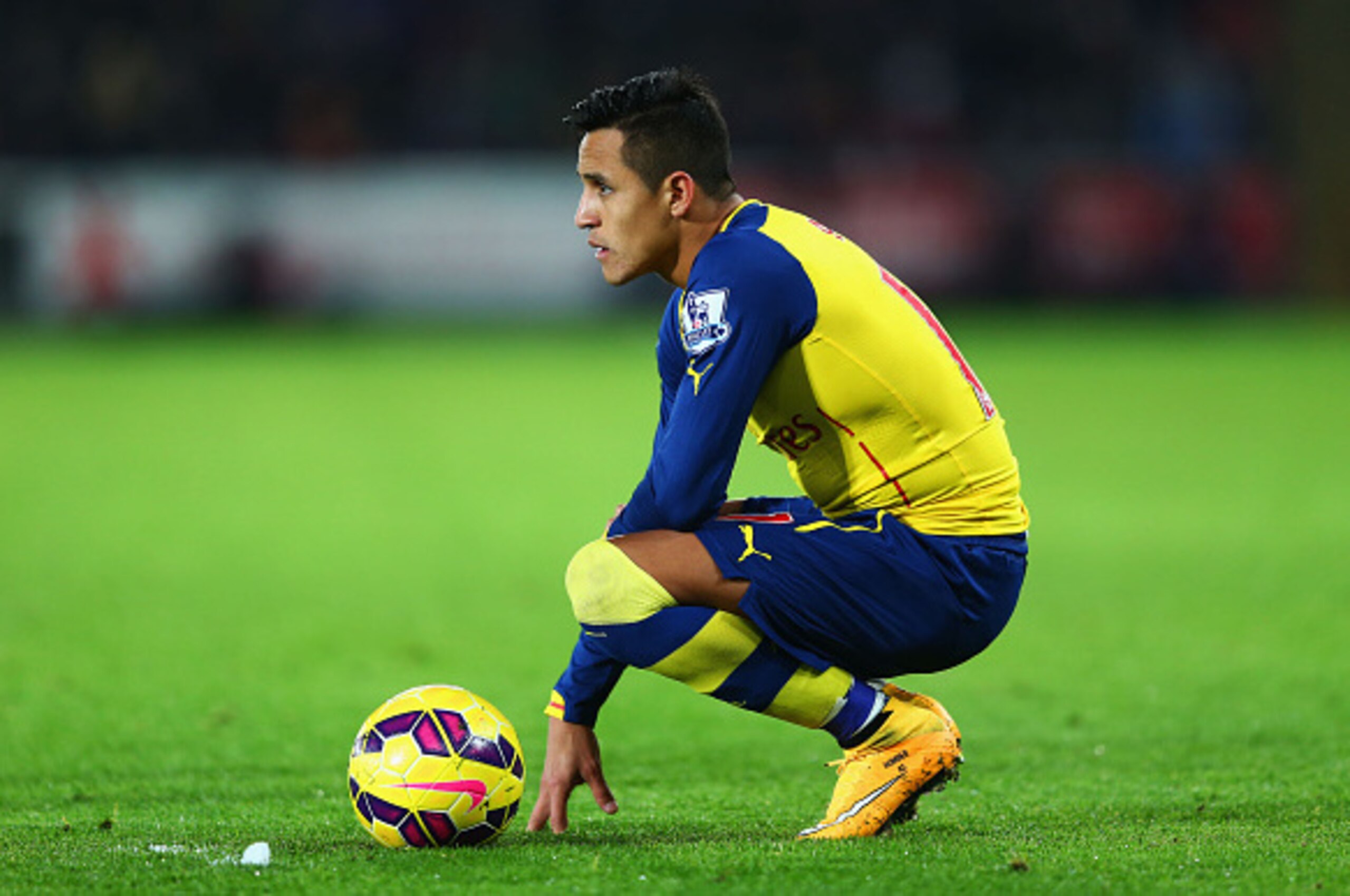SWANSEA, WALES - NOVEMBER 09:  Alexis Sanchez of Arsenal looks on during the Barclays Premier League match between Swansea City and Arsenal at Liberty Stadium on November 9, 2014 in Swansea, Wales.  (Photo by Michael Steele/Getty Images)