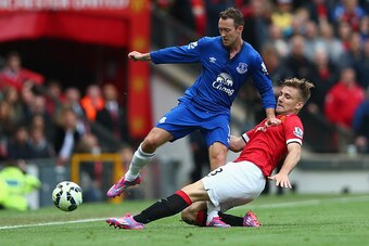 MANCHESTER, ENGLAND - OCTOBER 05:  Aiden McGeady of Everton is challenged by Luke Shaw of Manchester United during the Barclays Premier League match between Manchester United and Everton at Old Trafford on October 5, 2014 in Manchester, England.  (Photo b